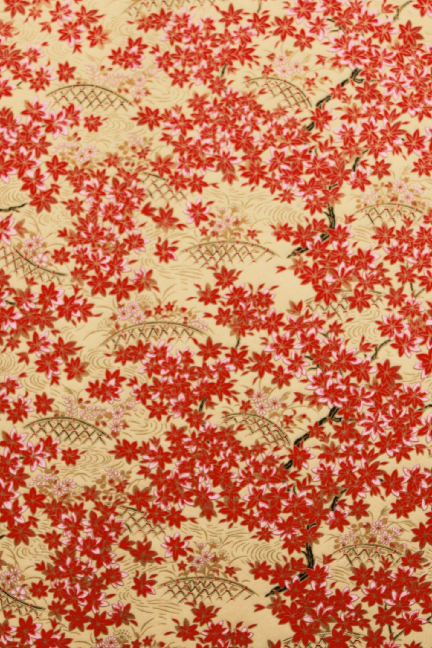 Floral patterned fabric with red flowers on a beige background