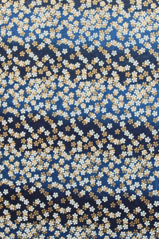 Patterned  chiyogami paper with small white flowers on a dark blue background