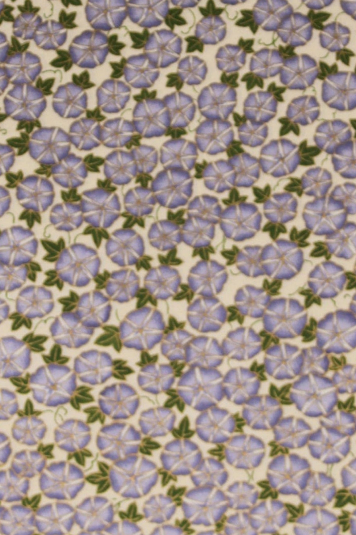 Patterned chiyogami paper with small purple flowers on a beige background