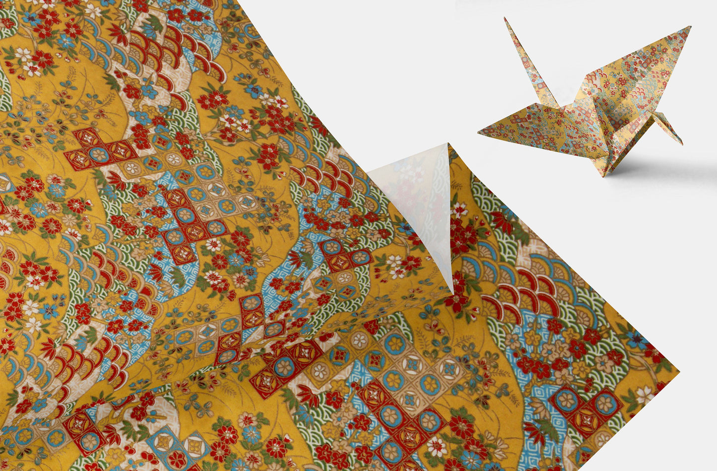 Decorative paper with floral patterns and an origami crane on a white background