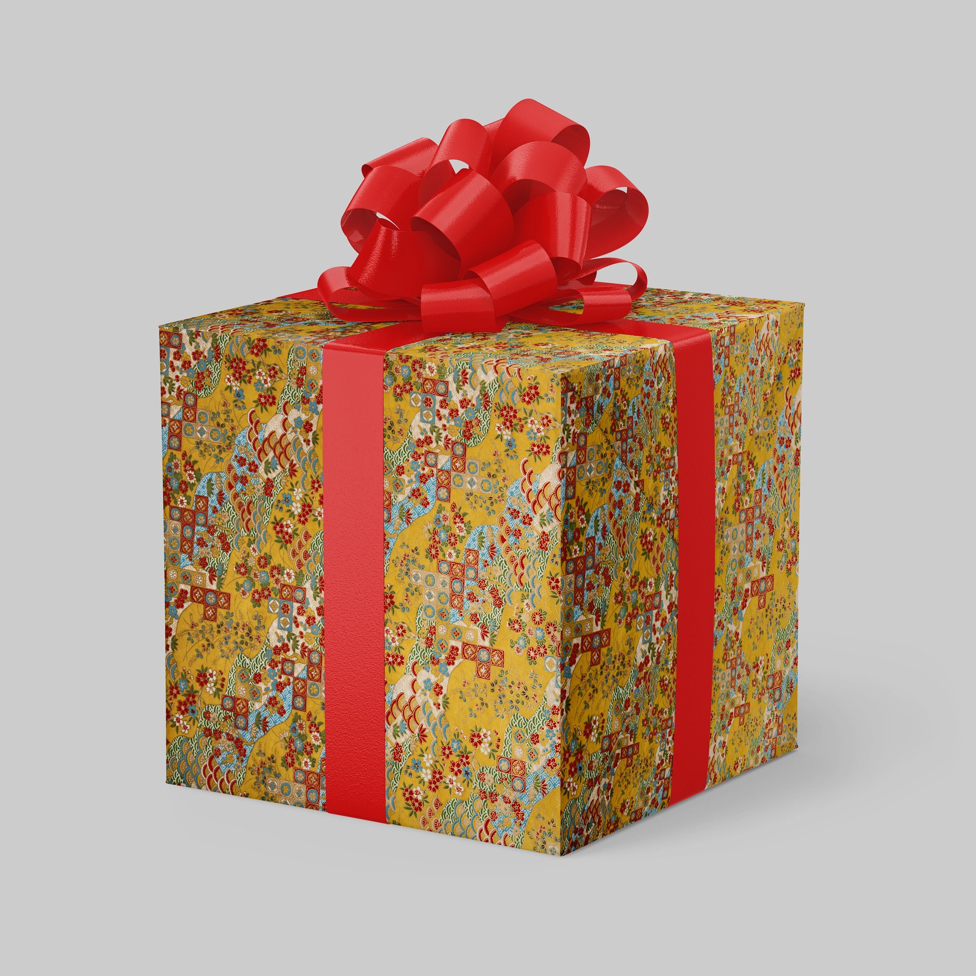 Gift box with colorful pattern and red ribbon on a gray background