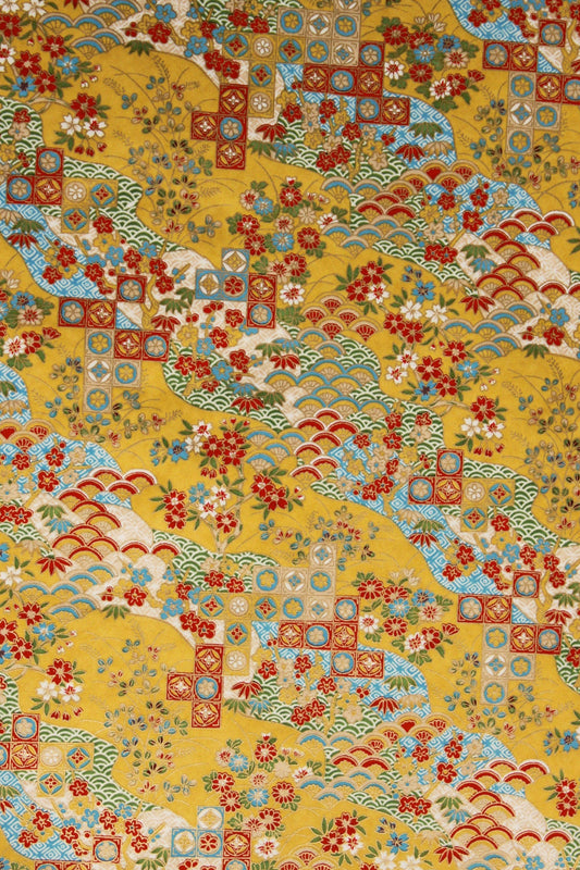 Patterned  chiyogami paper with a mix of geometric and floral designs on a yellow background