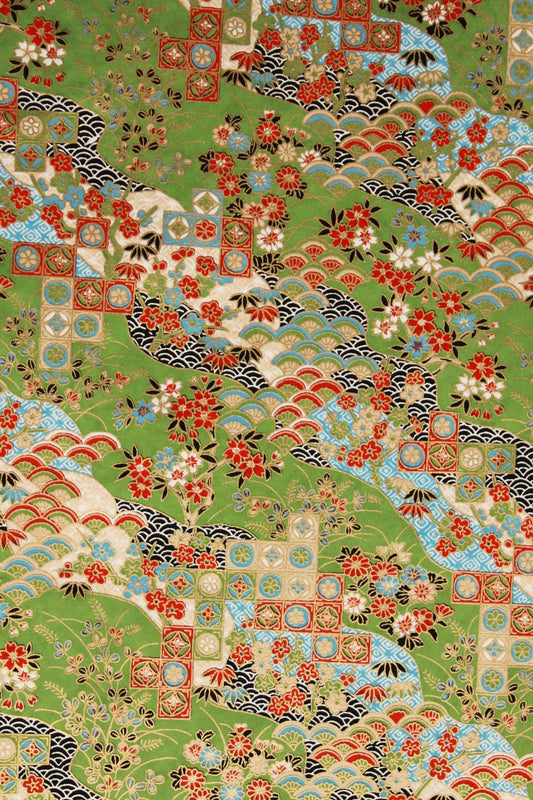 Chiyogami Paper with a traditional japanese pattern in green background with red blue and creme color in it. 