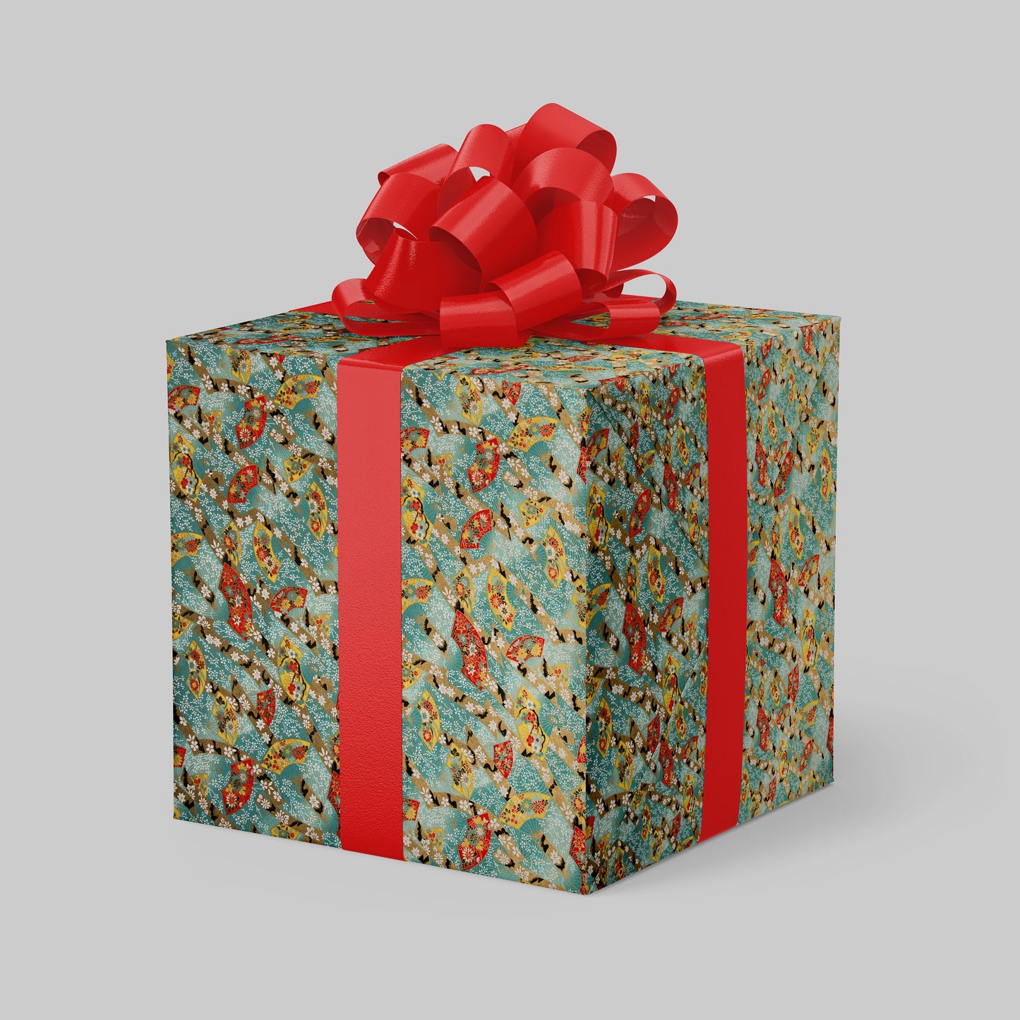 Gift box wrapped with chiyogami paper with floral pattern and red ribbon on a gray background
