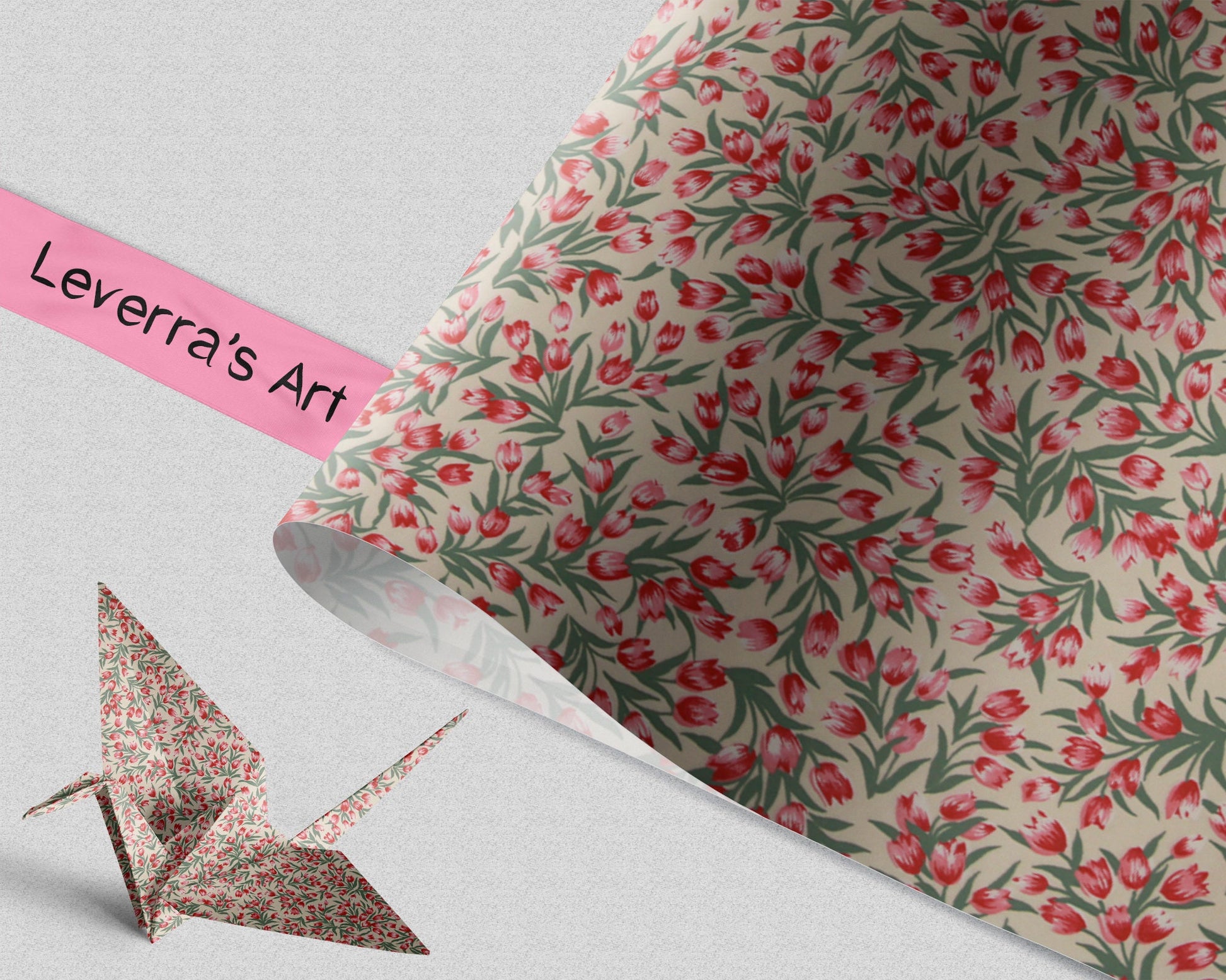 Floral-patterned paper with a origami crane on a light gray background