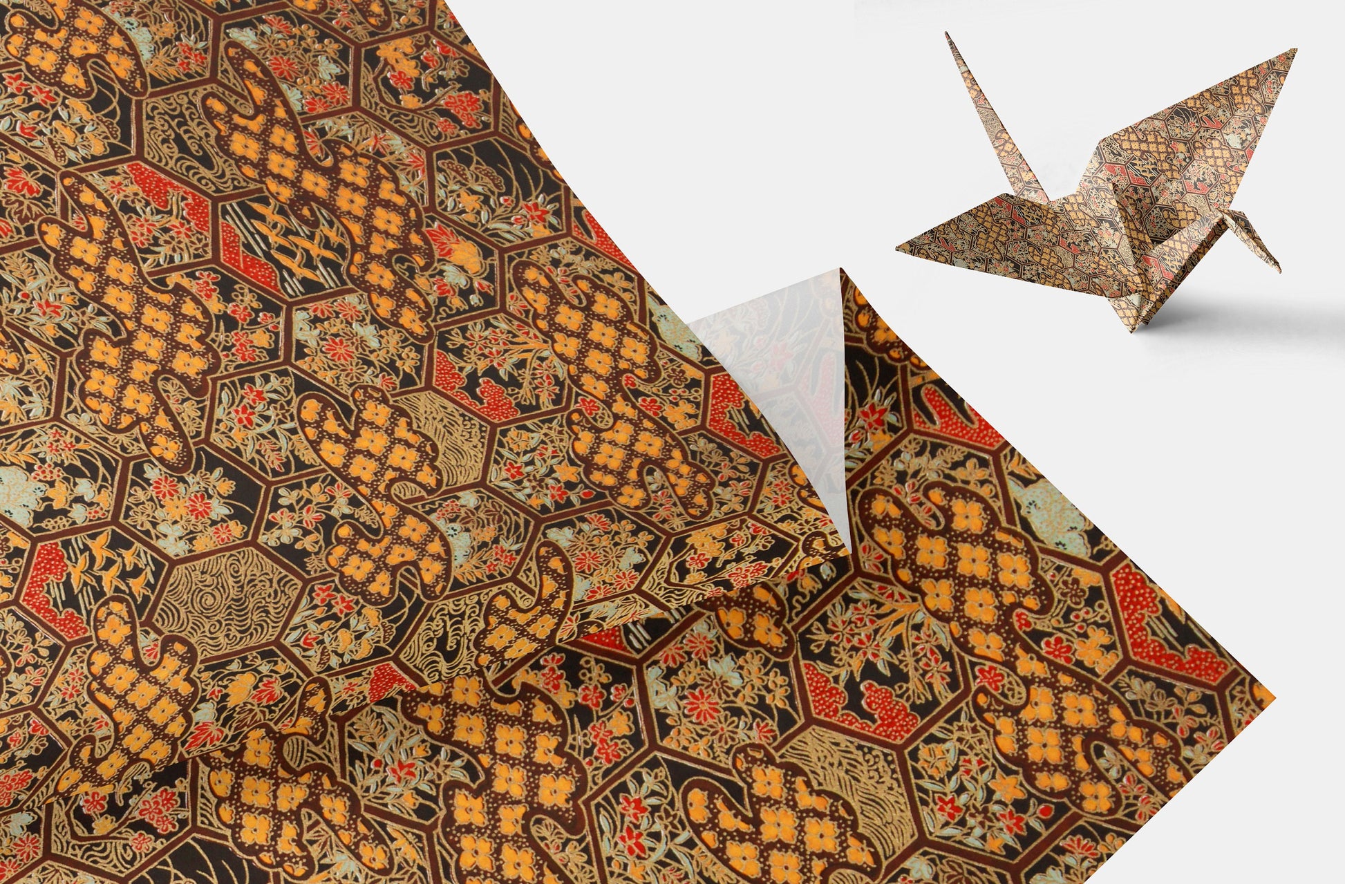 Decorative chiyogami paper with intricate patterns and a folded paper crane on a white background