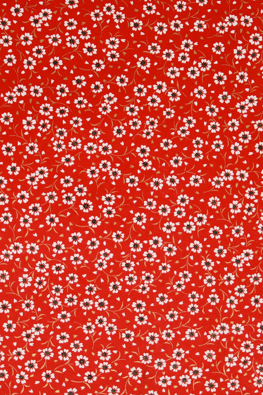 Red  chiyogami paper with small white floral pattern