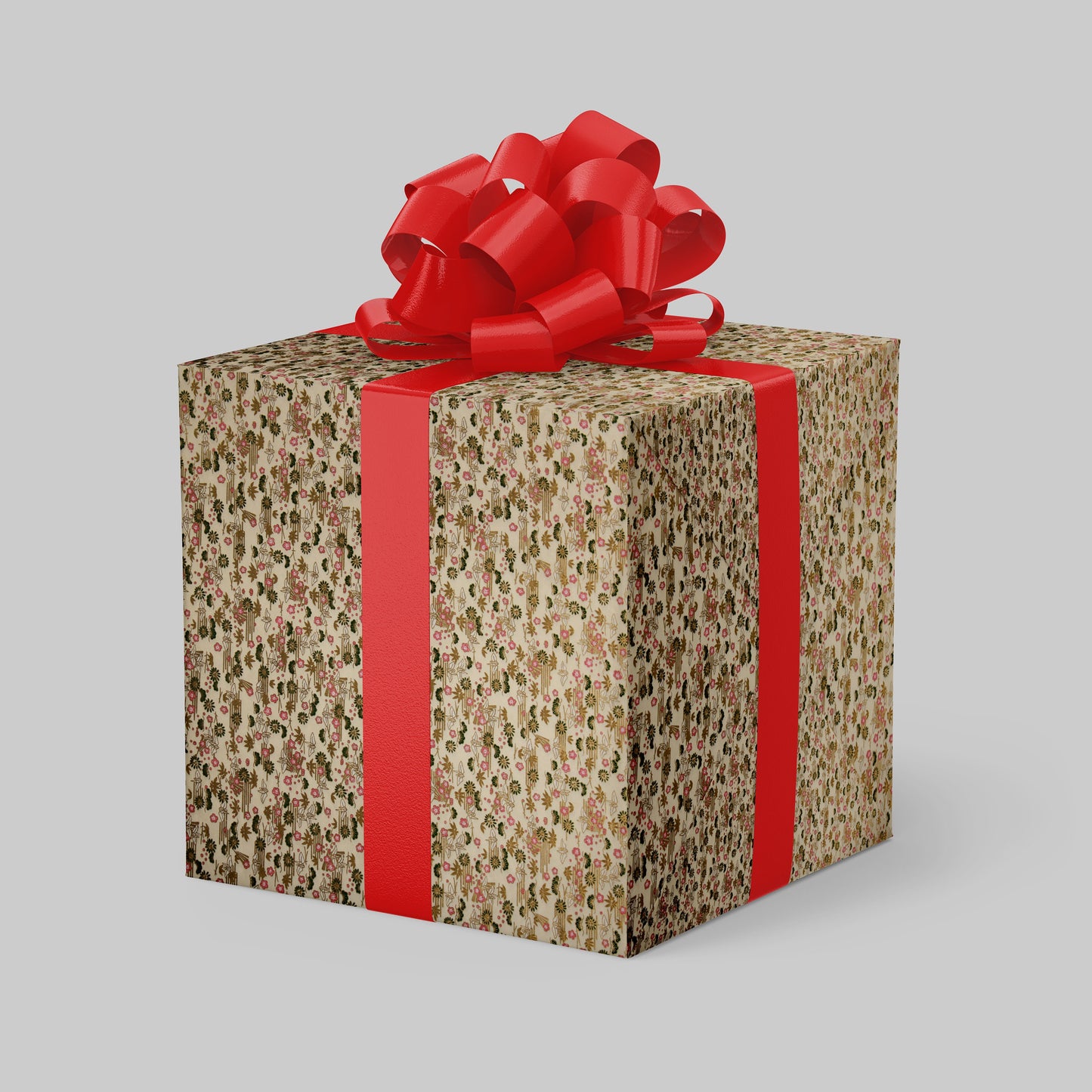 Gift box wrapped with chiyogami paper with floral pattern and red ribbon on a gray background