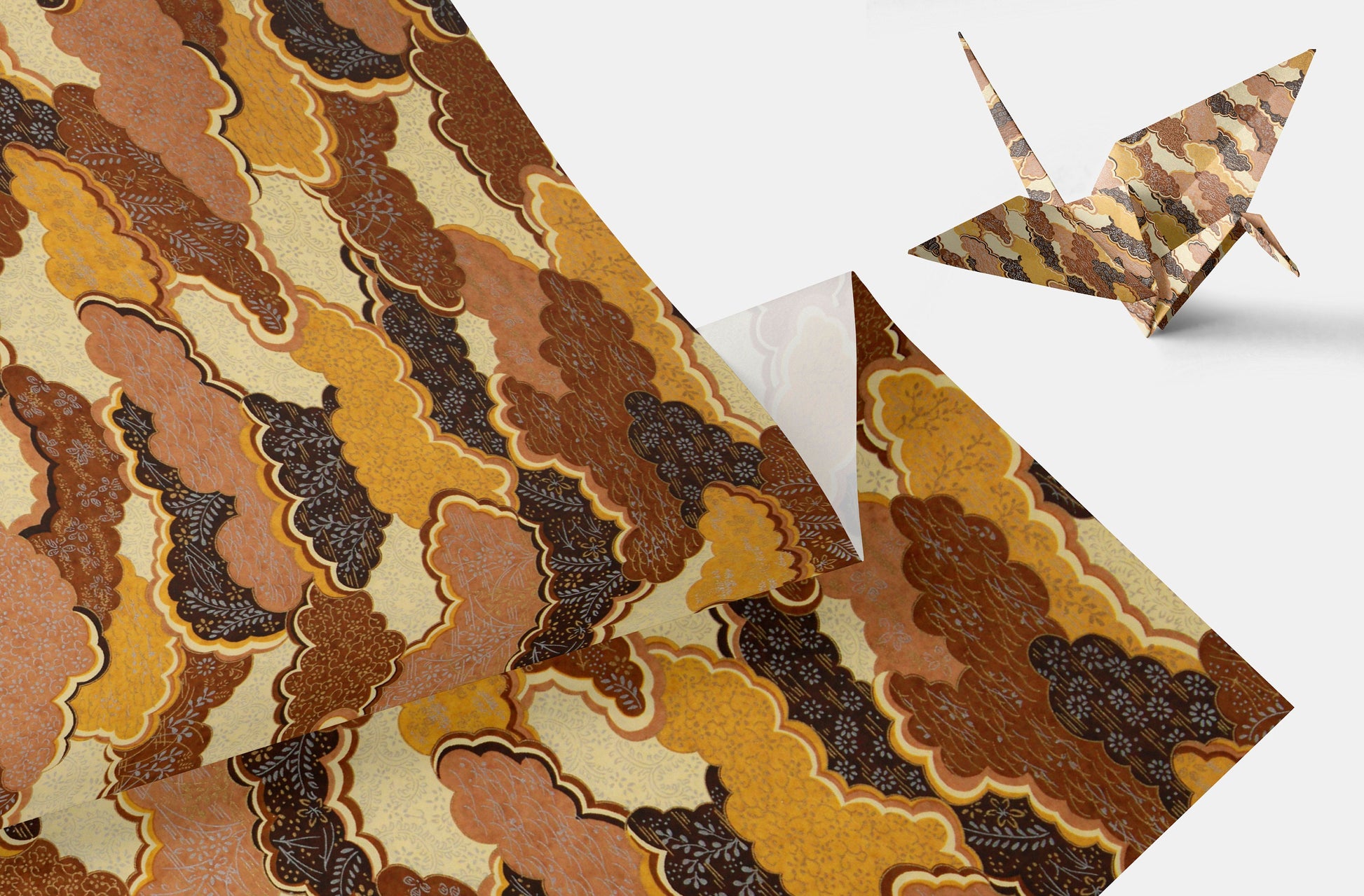 Patterned chiyogami paper with a folded origami crane on a white background