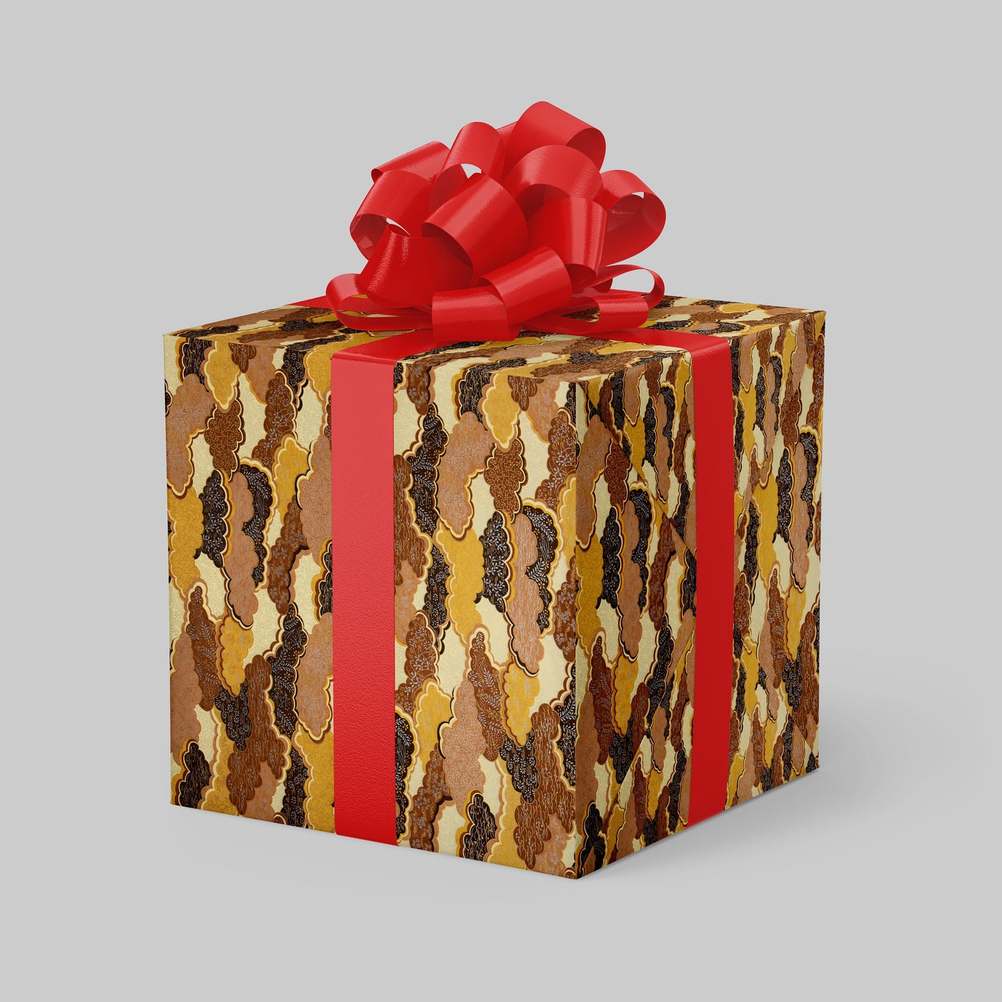 Gift box wrapped with chiyogami paper with camouflage pattern and red bow on a gray background