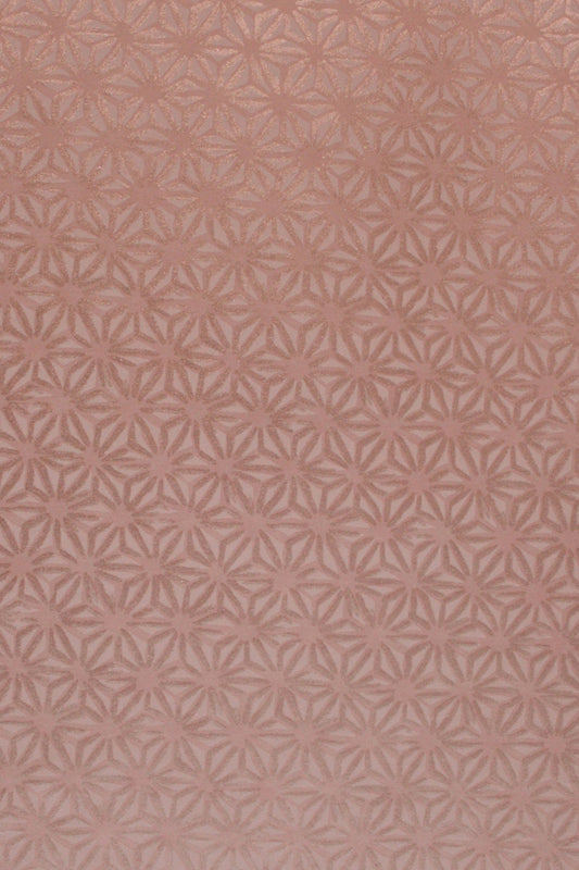 Patterned chiyogami paper with a geometric design on a pink background