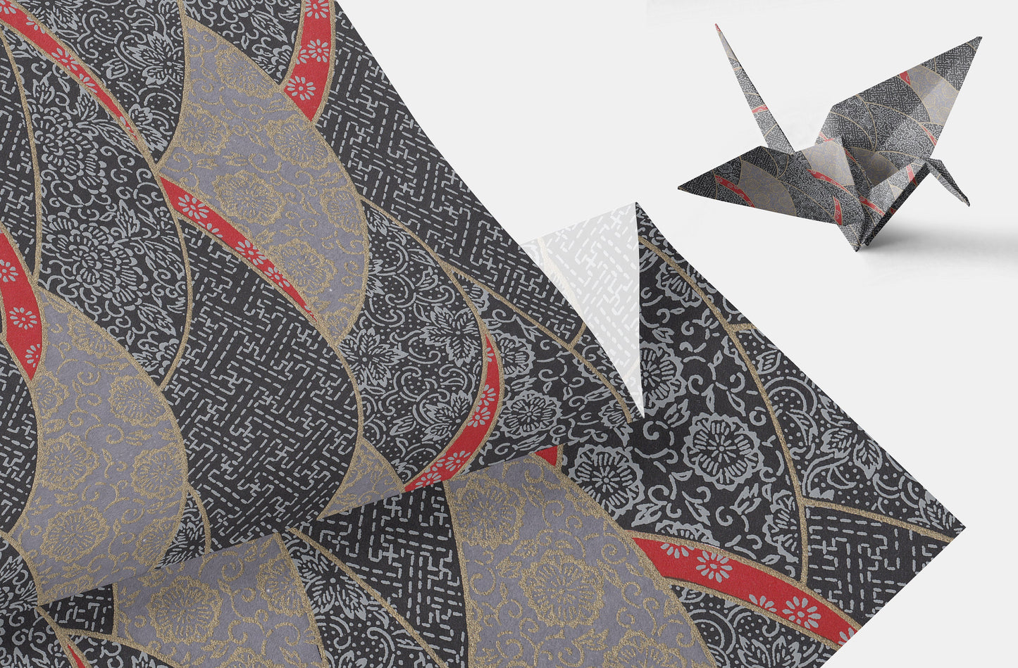Decorative chiyogami paper with intricate patterns and a folded paper crane on a white background