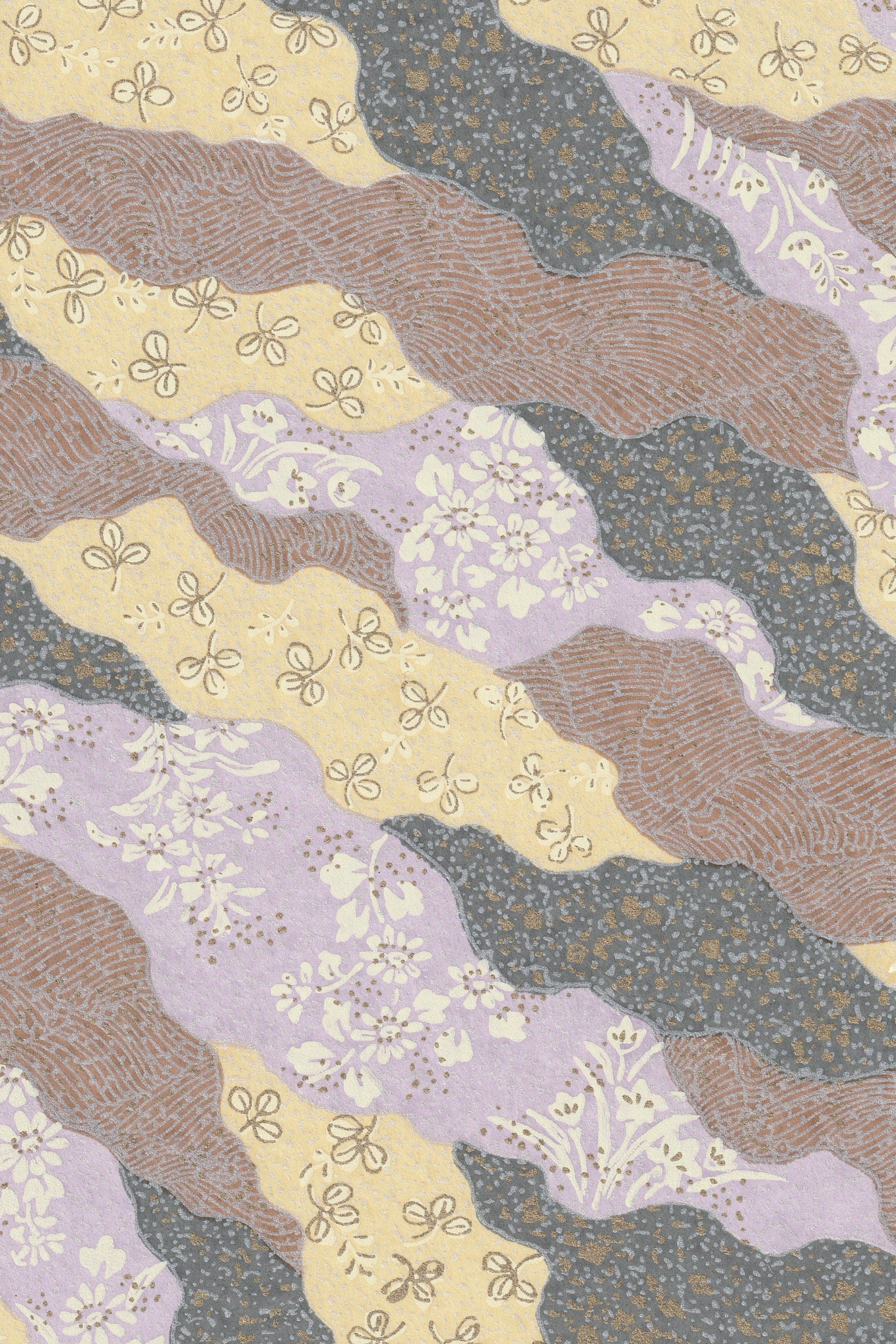 Patterned chiyogami paper with wavy lines and floral designs in brown, yellow, and purple.