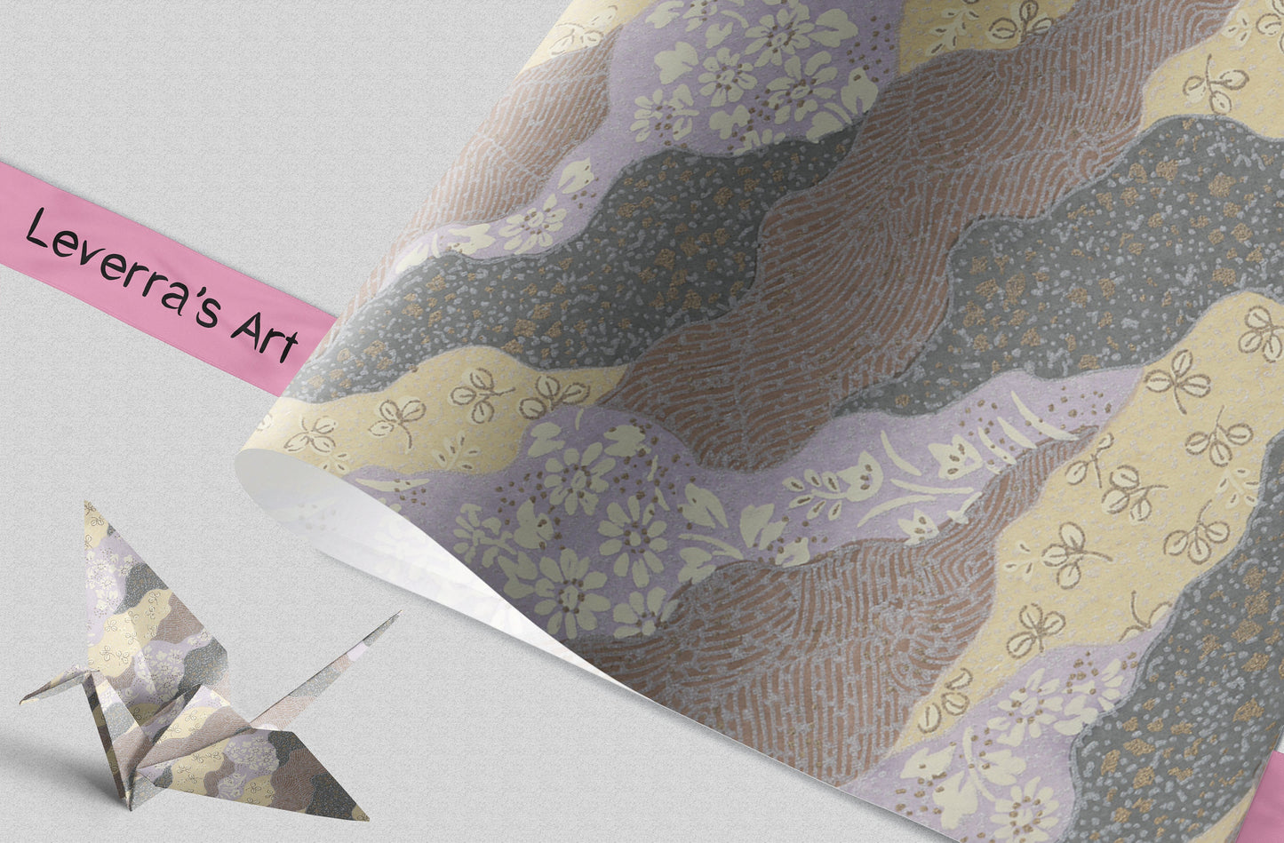 Decorative chiyogami paper with floral patterns and a small origami-like figure on a light gray background.
