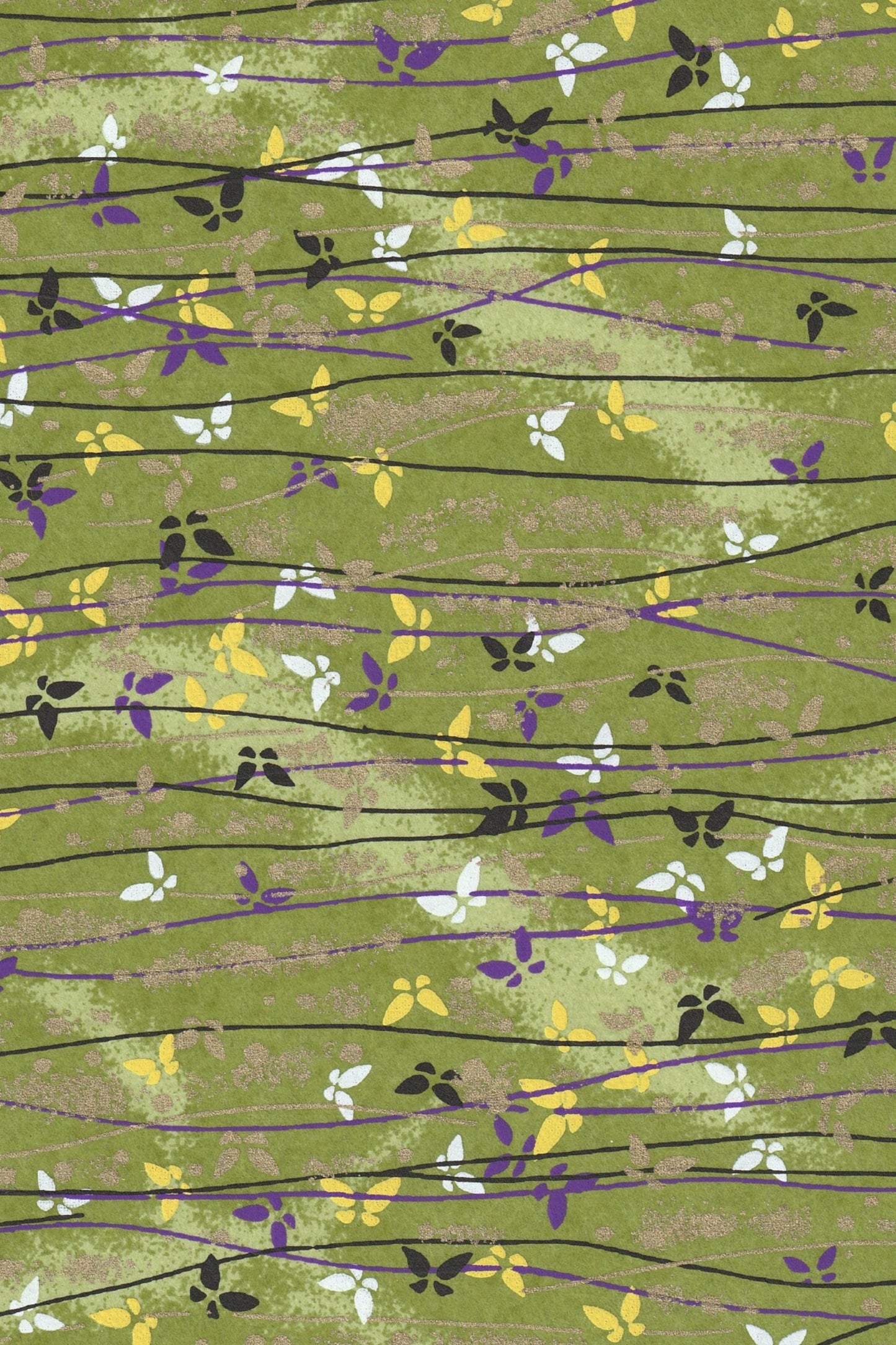 Patterned chiyogami paper with green background and black, purple, and yellow floral design