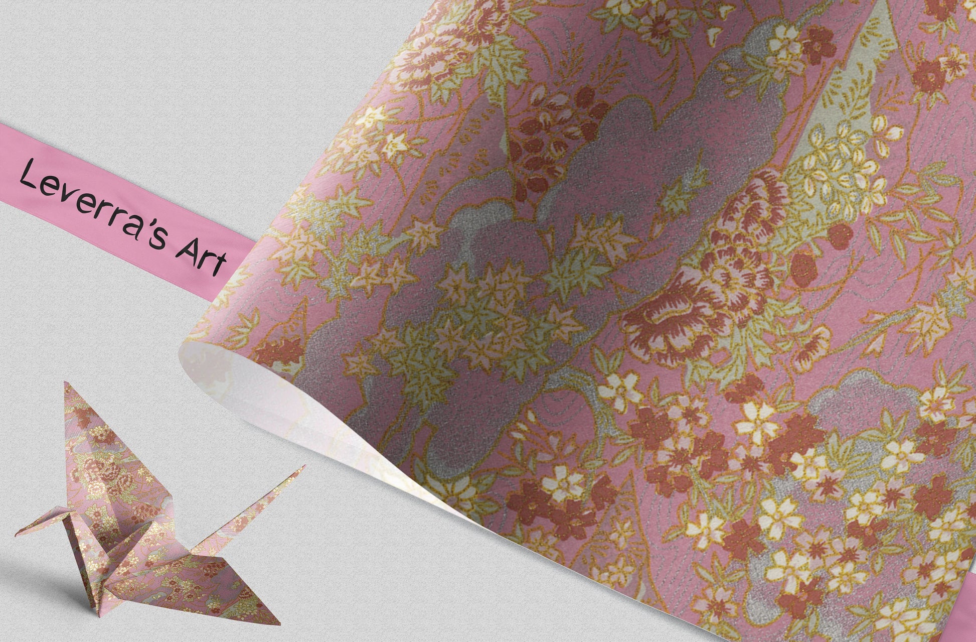 Floral patterned chiyogami paper with a pink origami crane on a light gray background, featuring 'Leverra's Art' branding.