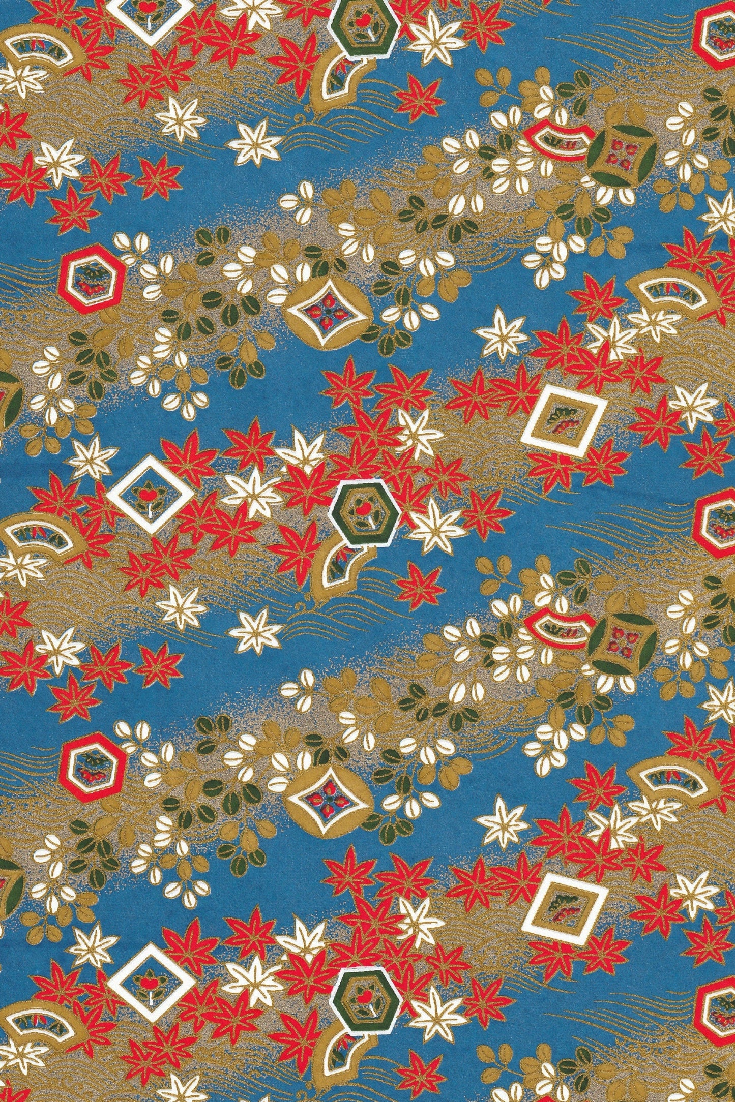 Decorative chiyogami paper pattern with red, white, and gold elements on a blue background