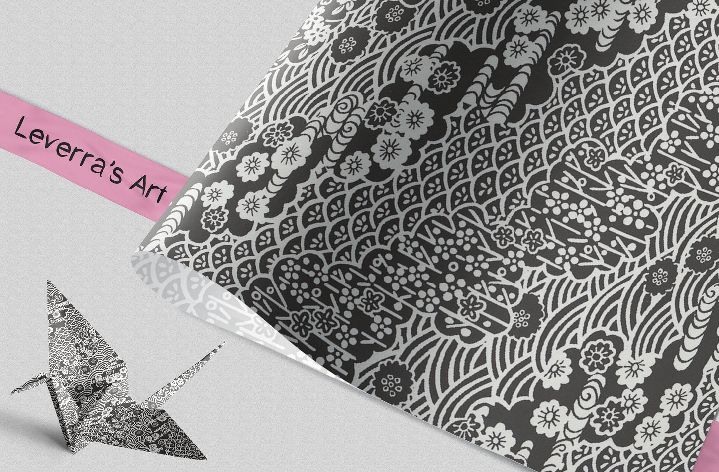 Decorative paper with black floral pattern and 'Leverra's Art' branding, featuring an origami crane.