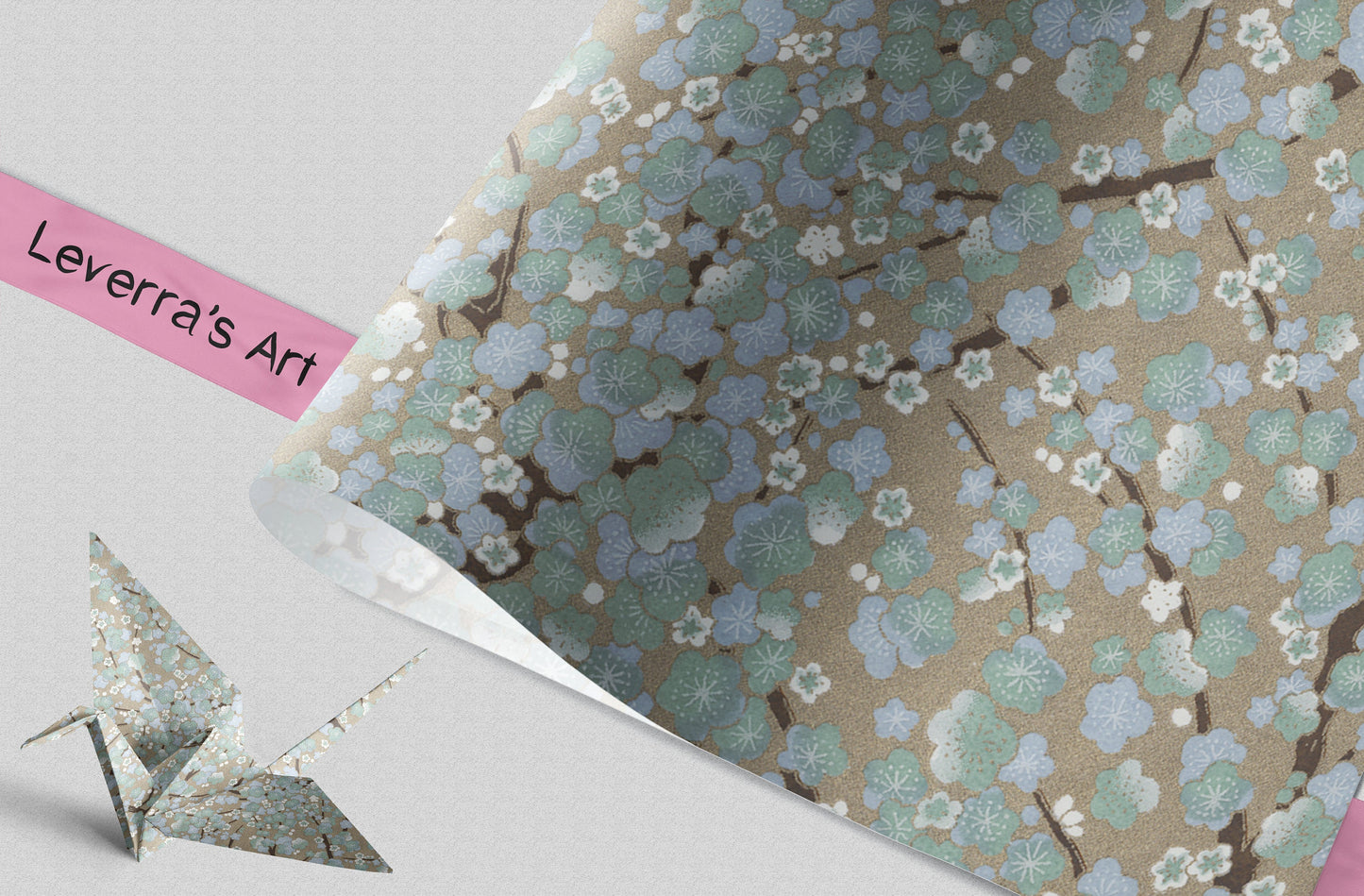 Floral patterned chiyogami paper with a pink strip and origami crane on a light background