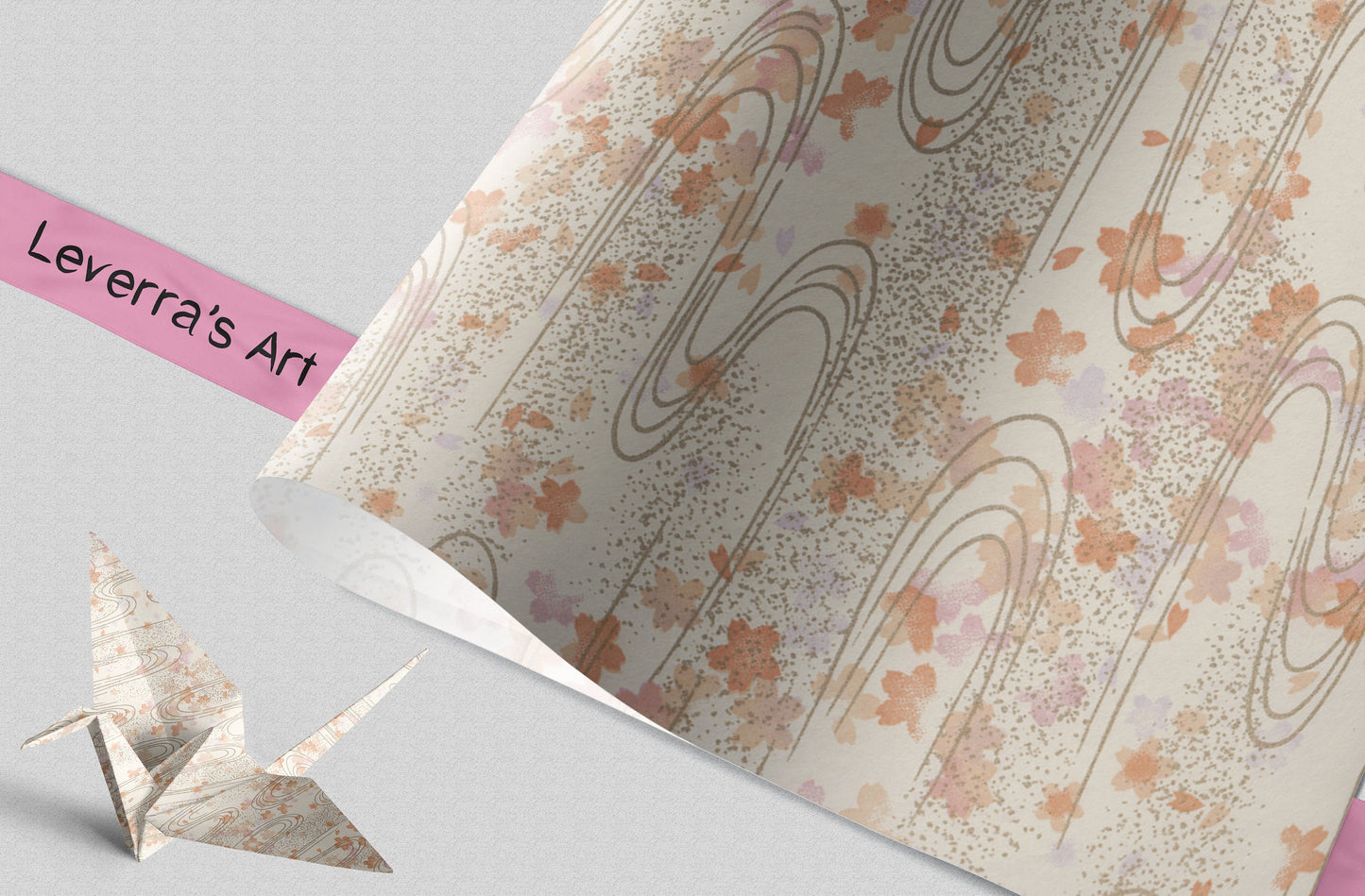 Decorative paper with floral and swirl patterns and a folded paper crane on a light gray background.