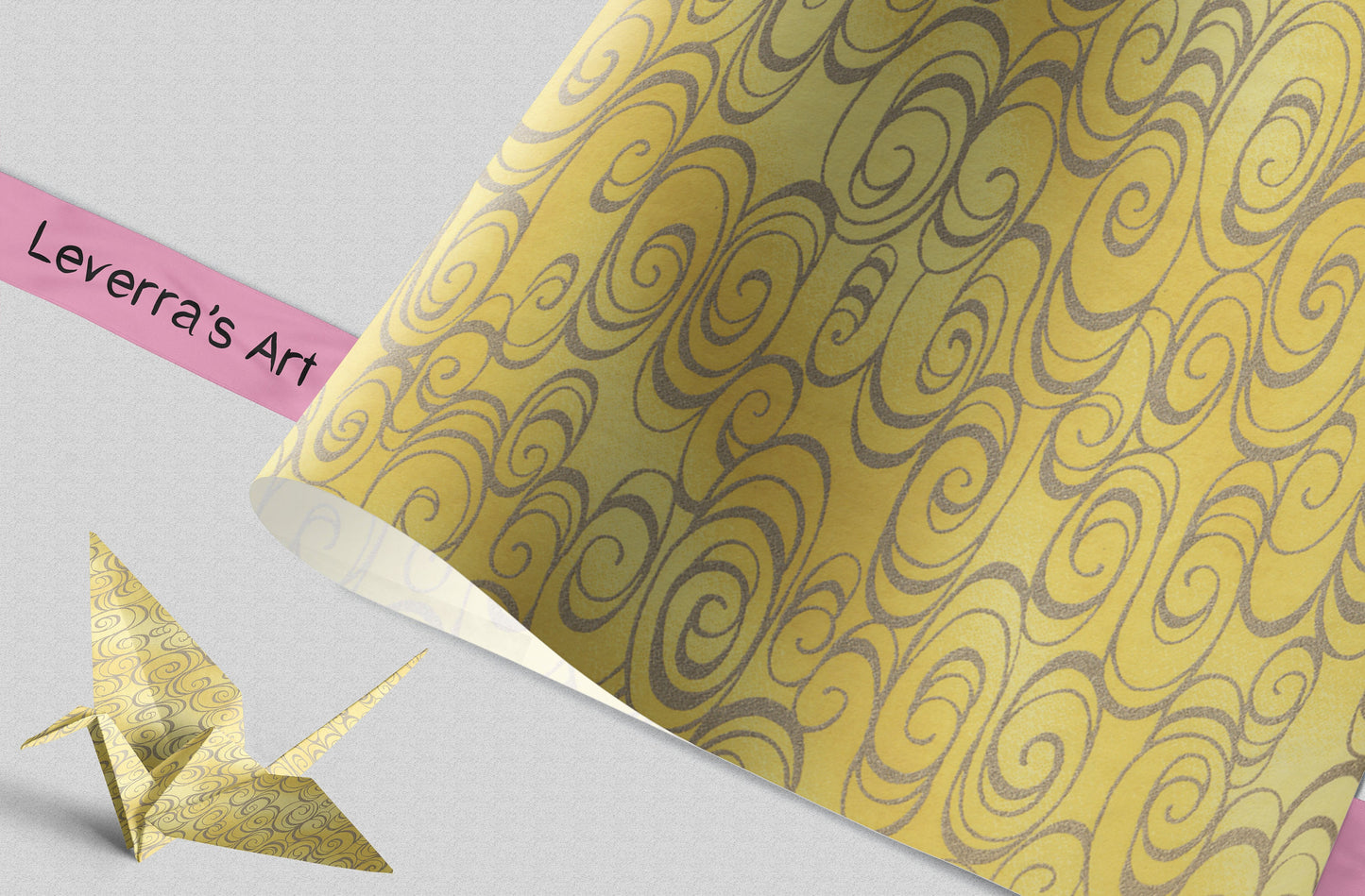 Chiyogami Paper with grey swirl patterns on yellow background and 'Leverra's Art' label, featuring an origami crane.