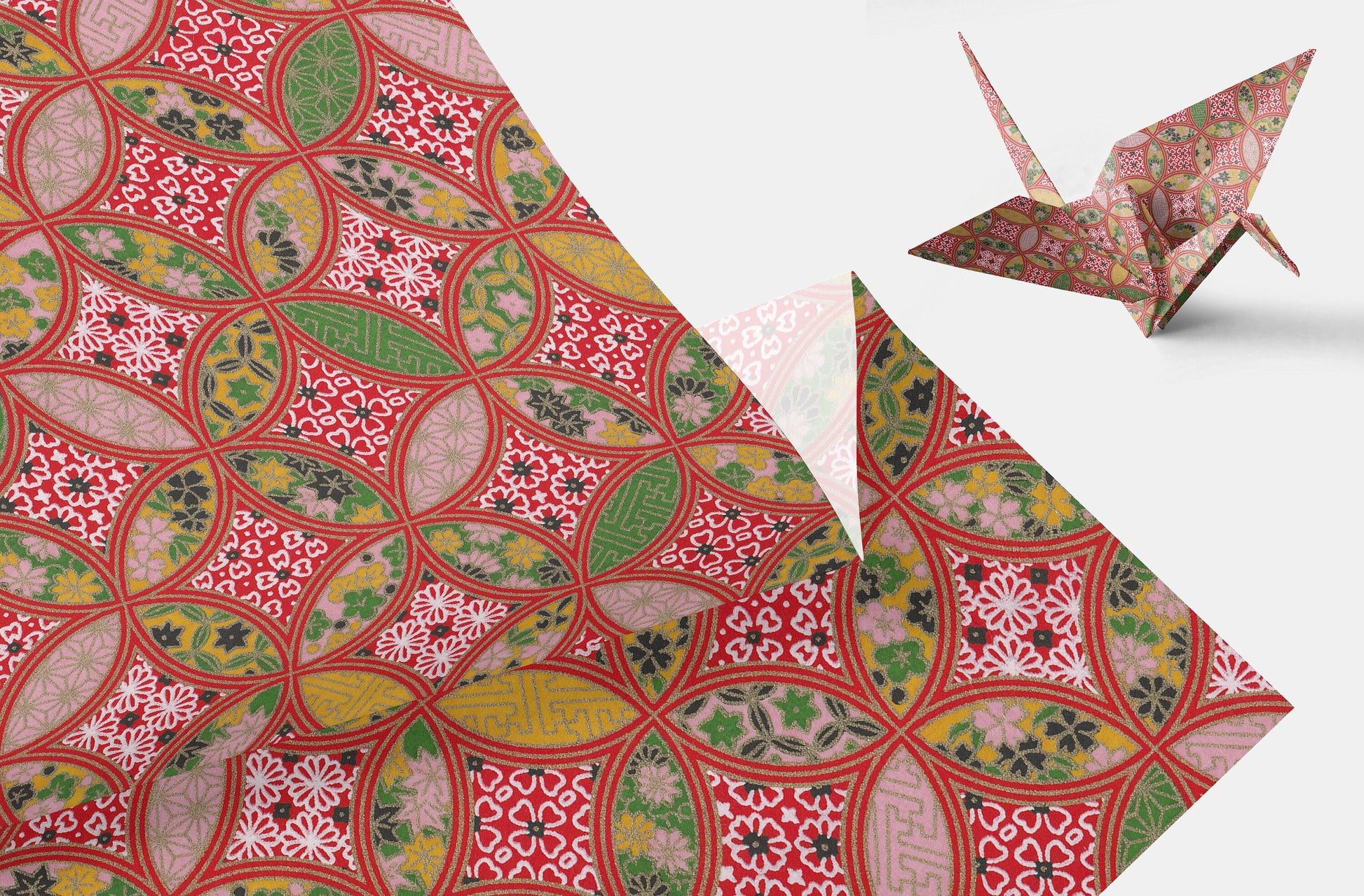 Patterned paper with a folded paper crane on a white background