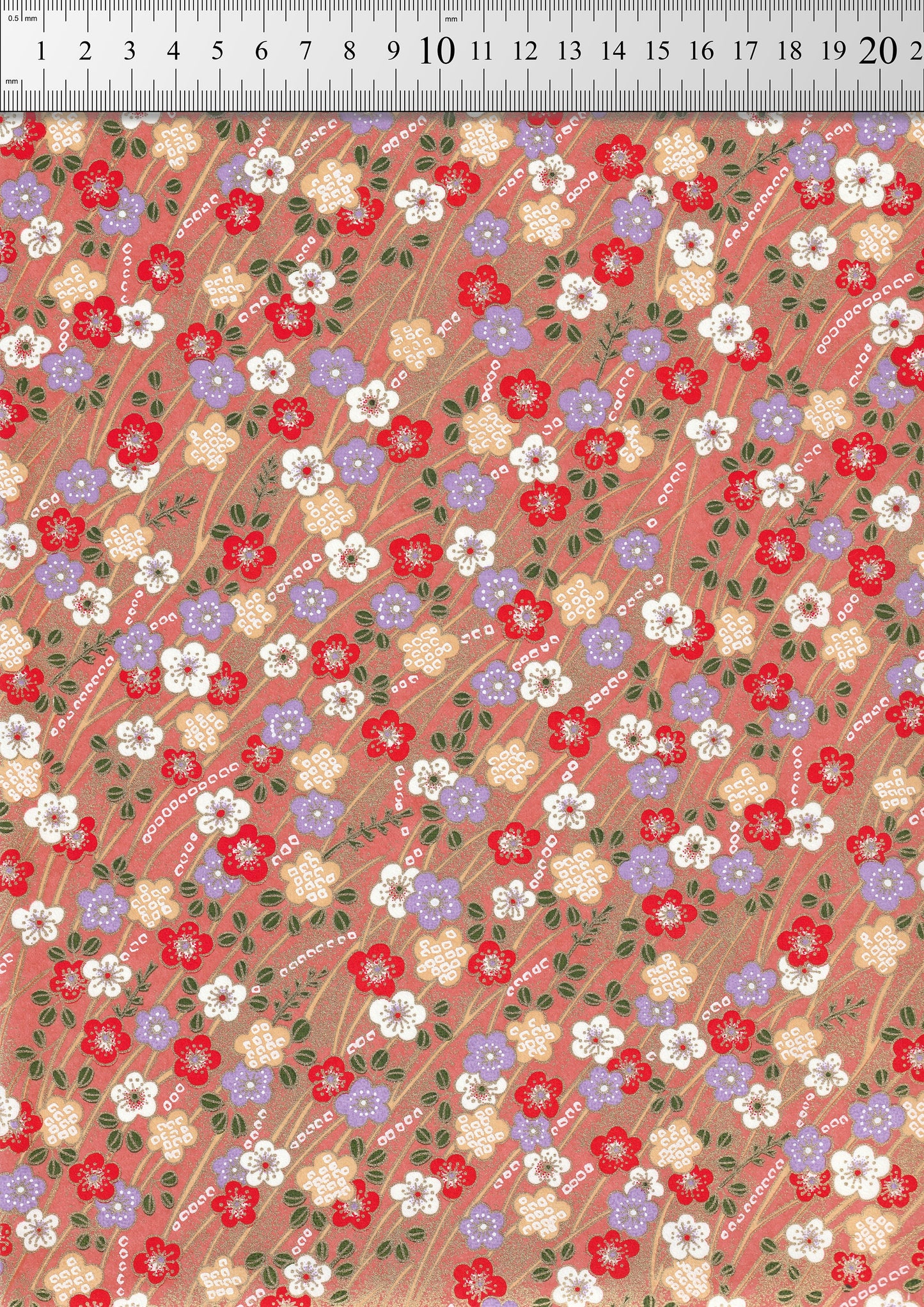 Floral patterned chiyogami paper with a ruler at the top for scale.