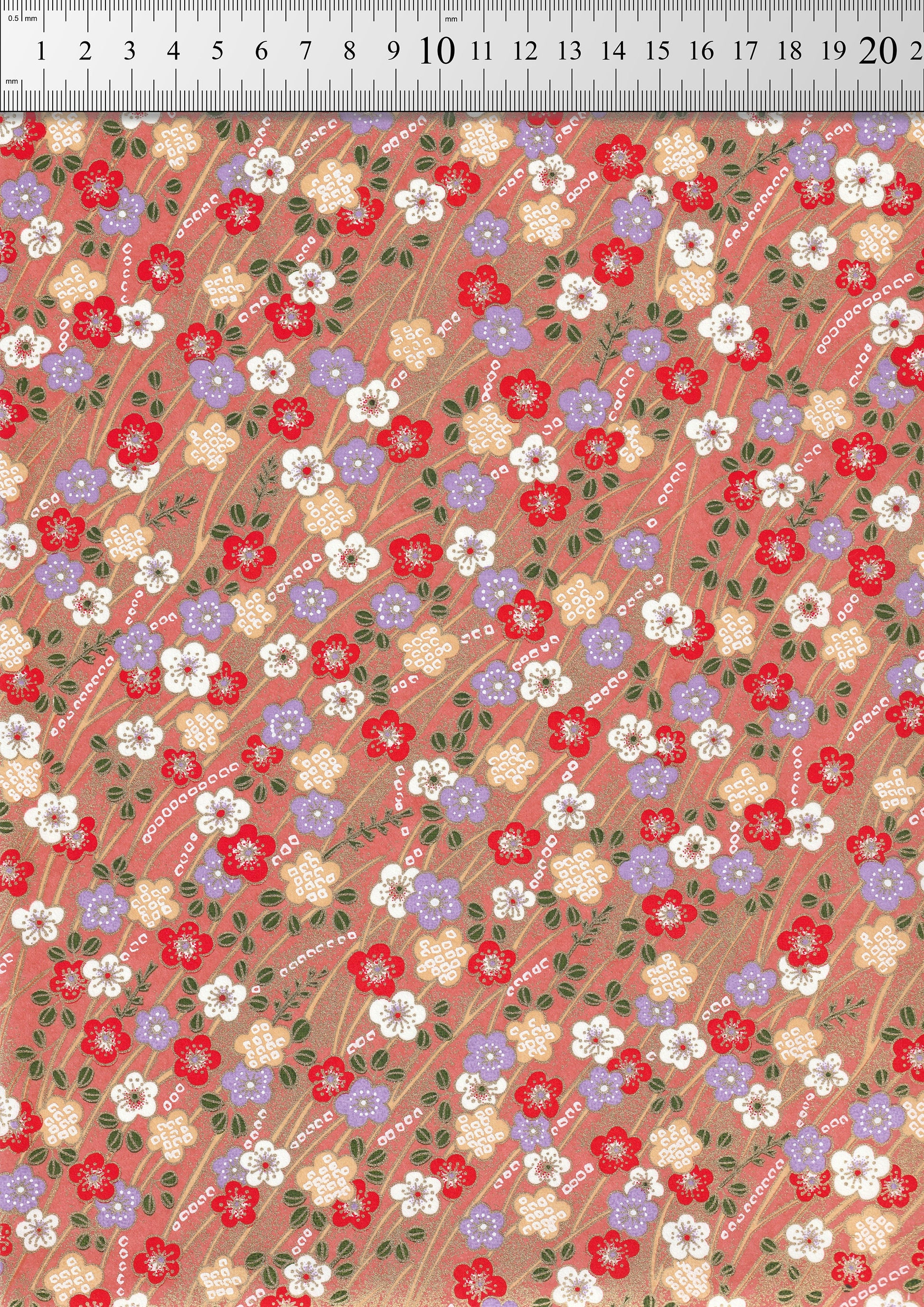 Floral patterned chiyogami paper with a ruler at the top for scale.