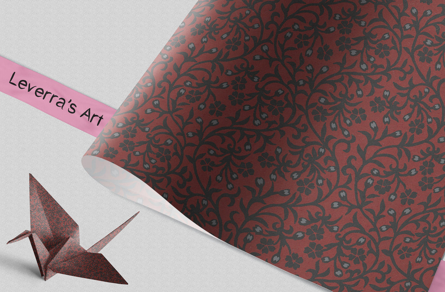 Decorative paper with floral pattern and a folded paper crane on a white background, featuring 'Leverra's Art' branding.