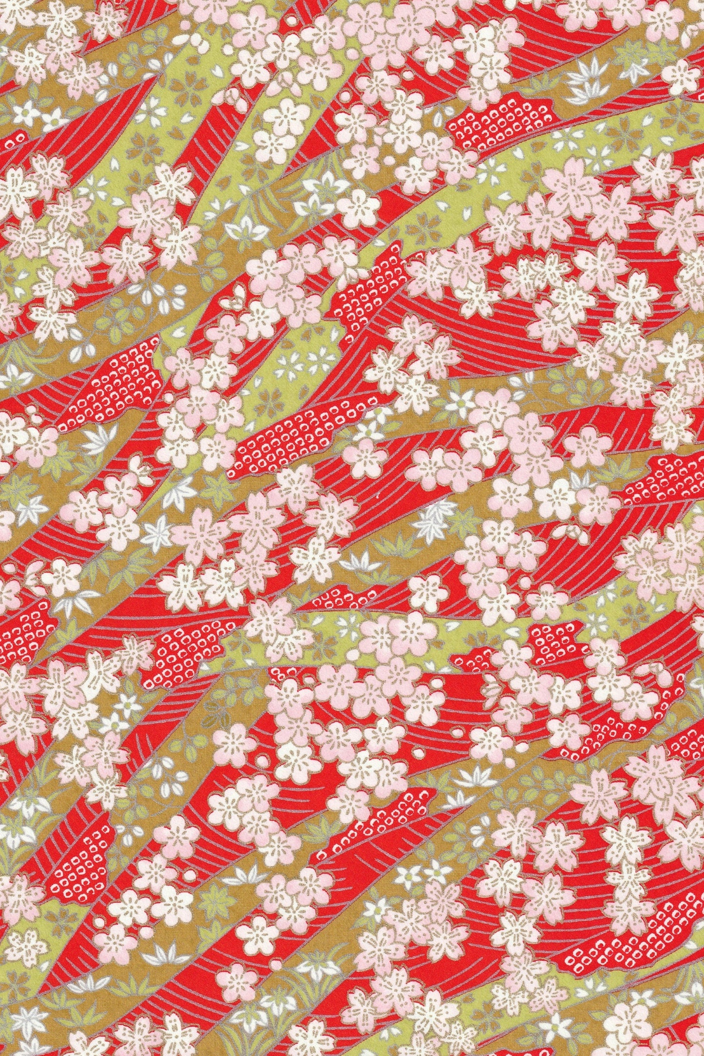 Pattern of red and white abstract shapes on a green background