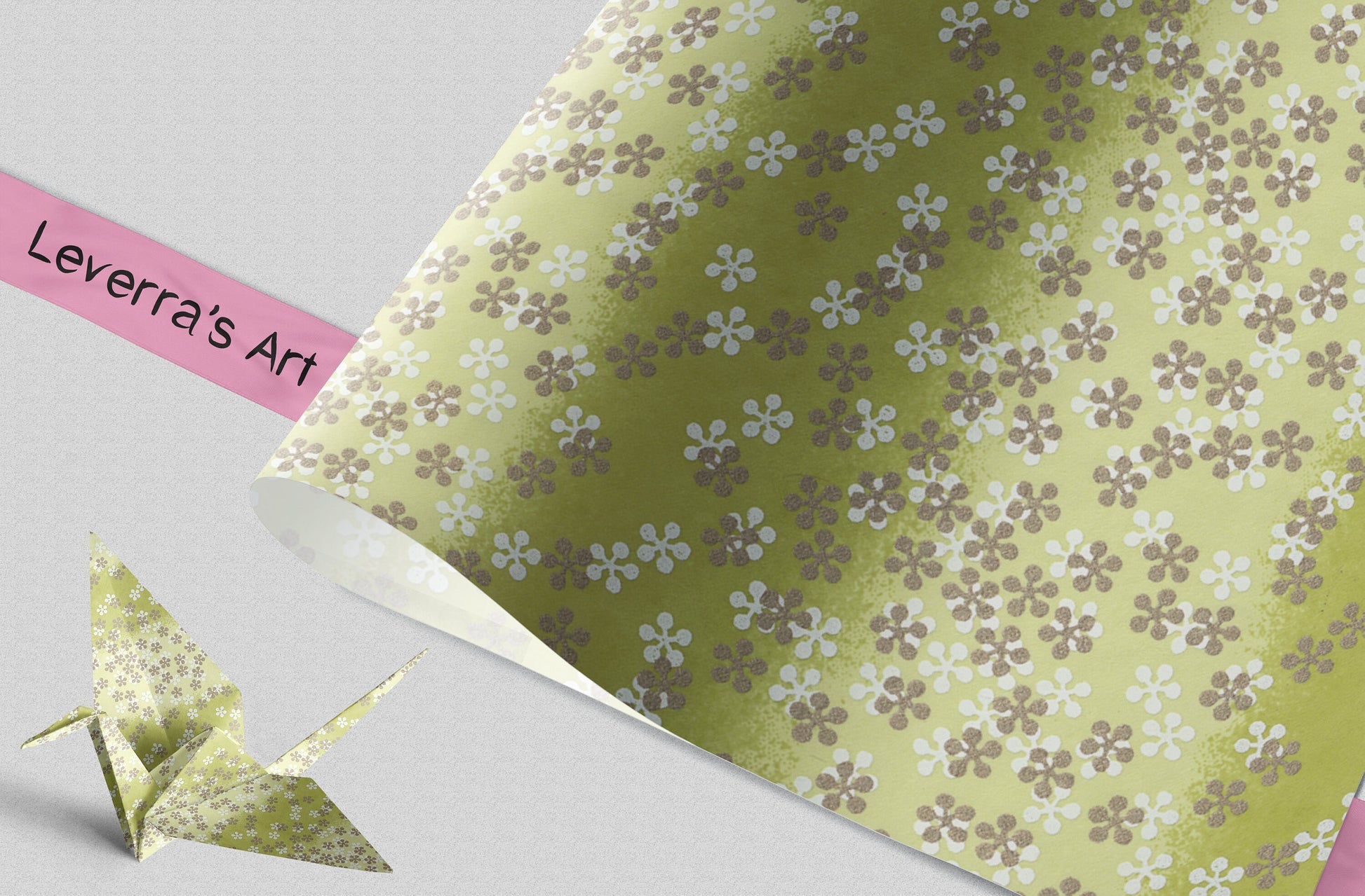 Floral-patterned paper with an origami crane on a gray background, featuring 'Leverra's Art' branding.