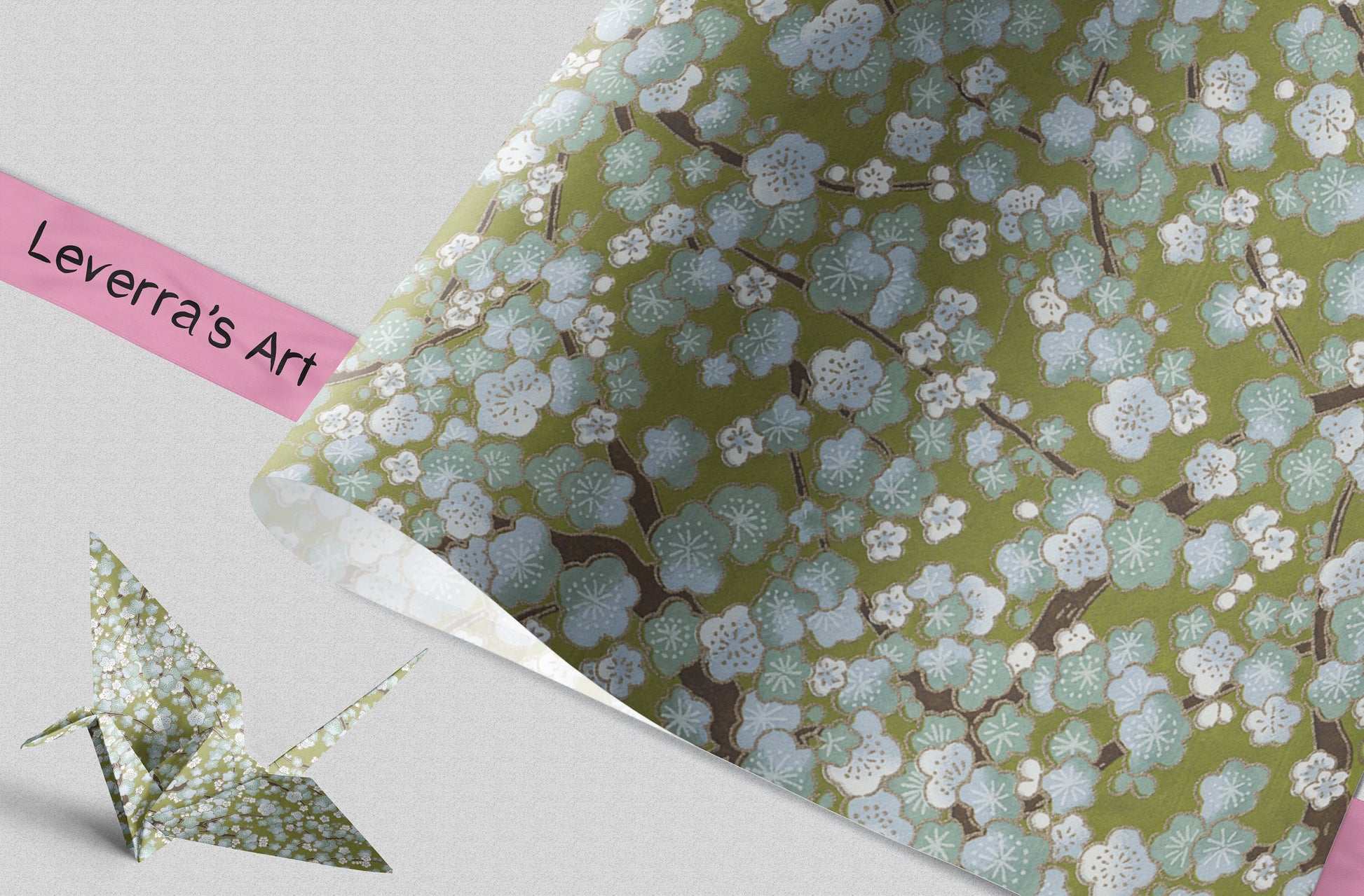 Roll of floral patterned paper with an origami crane on a light gray background, featuring 'Leverra's Art' branding.