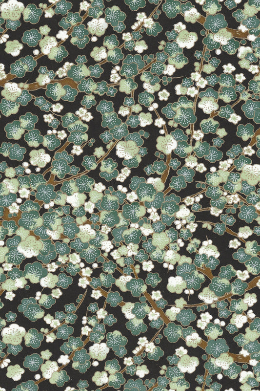 Floral patterned chiyogami paper with green and white flowers on a black background