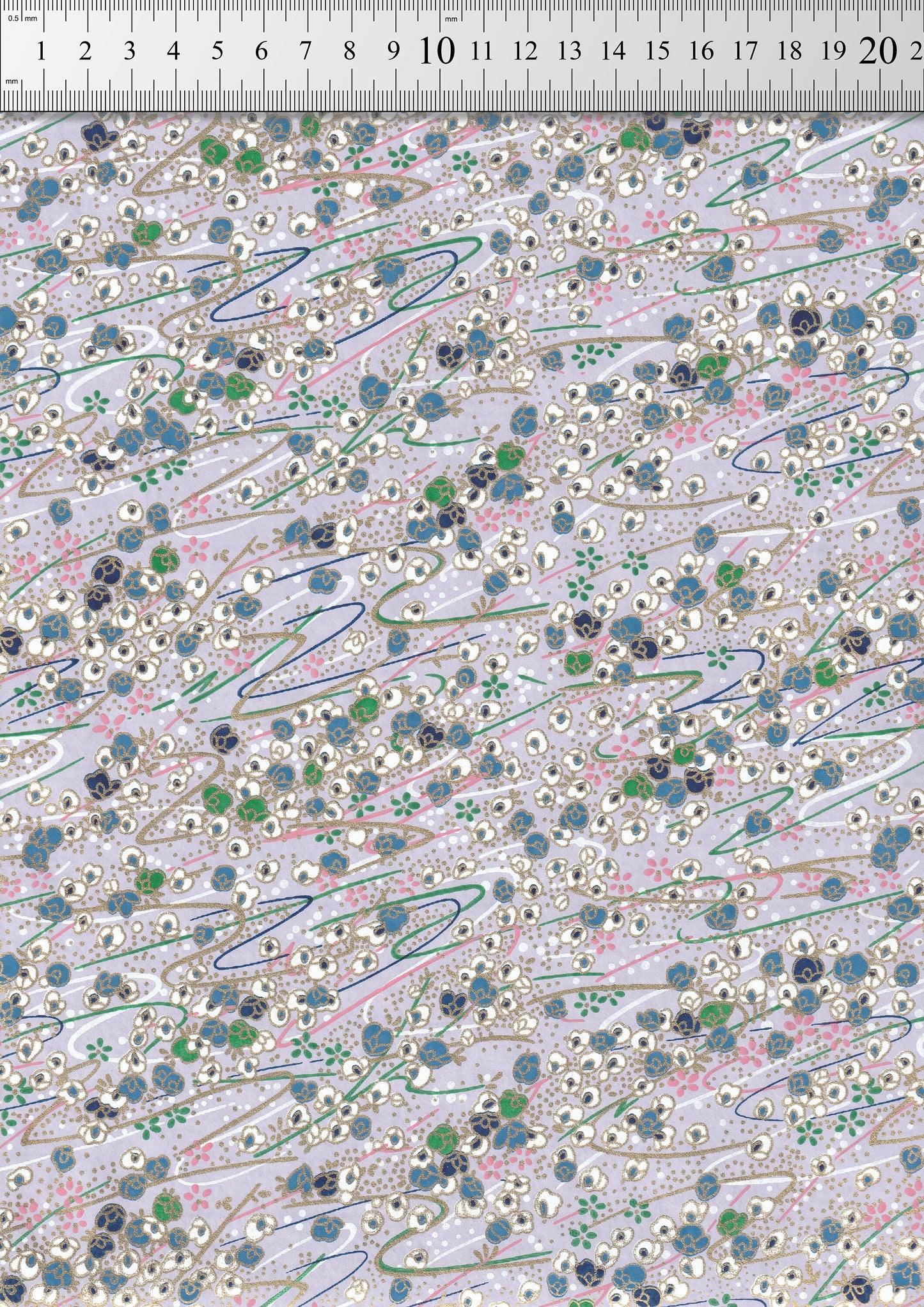 Textile pattern with small floral and abstract shapes on a light background