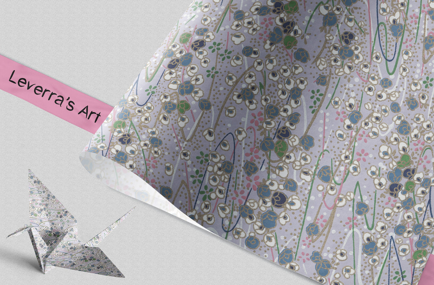 Decorative paper with floral pattern and 'Leverra's Art' label, featuring an origami crane.
