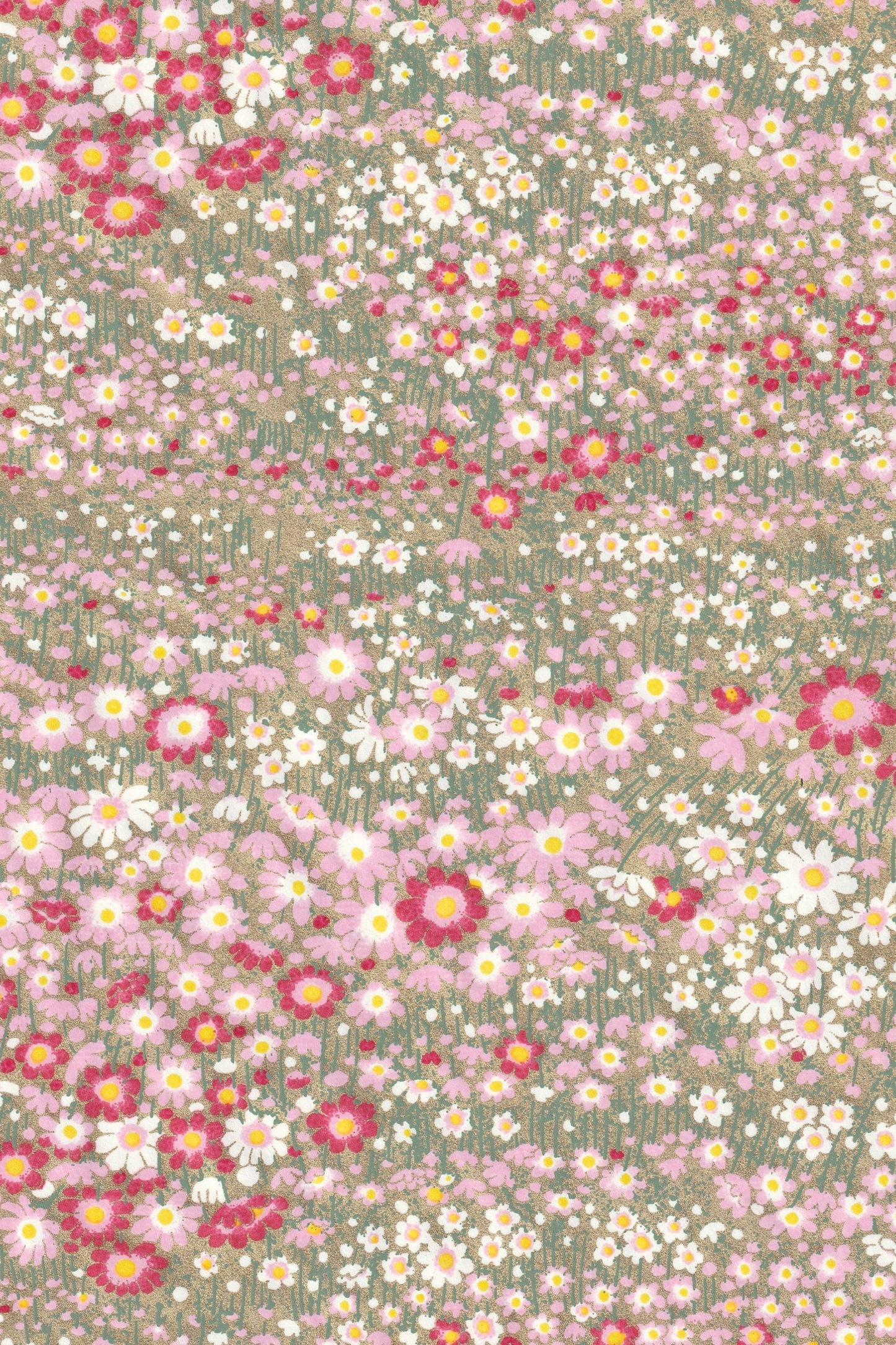 chiyogami paper with pattern of small flowers in pink, white, and red on a green background