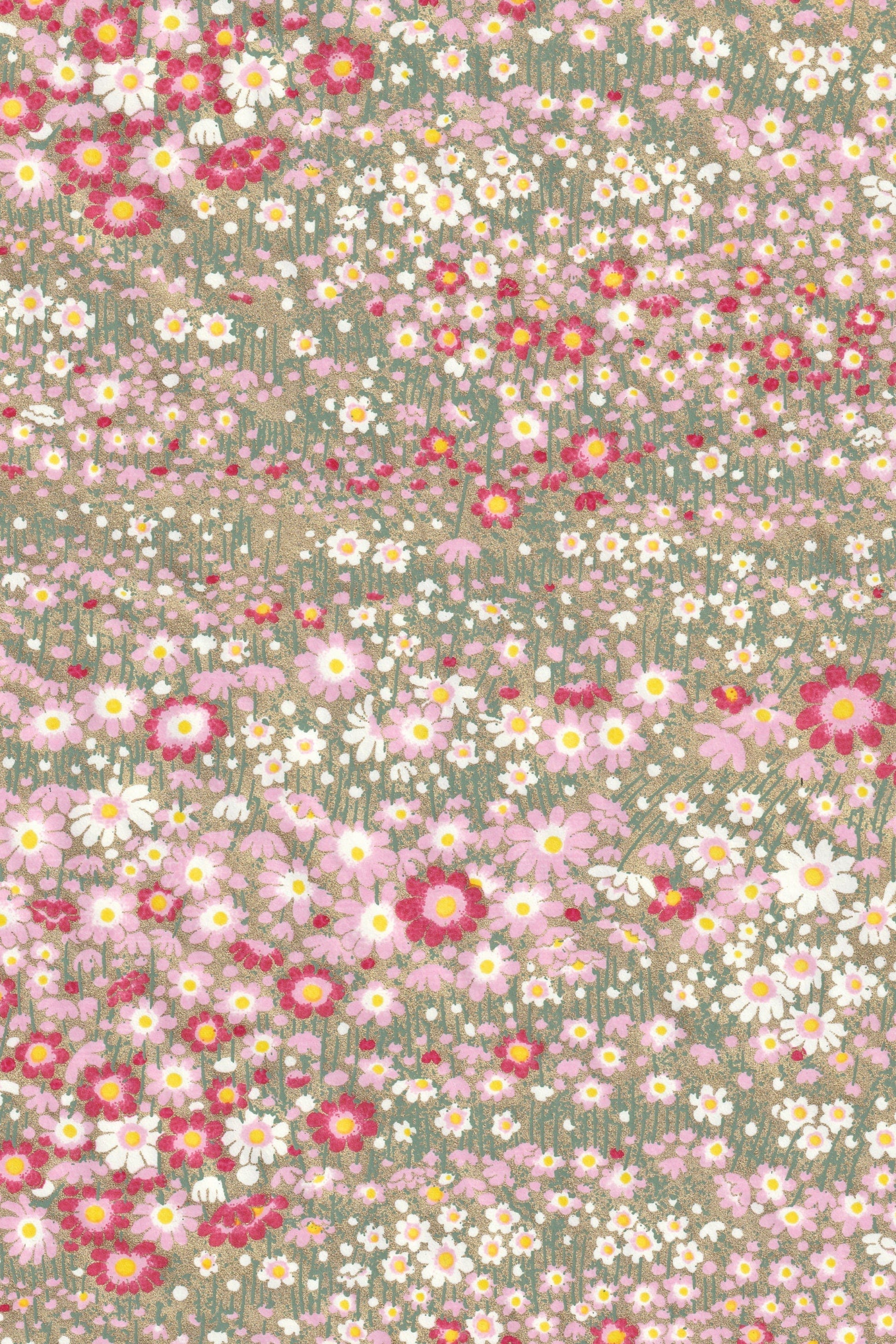 chiyogami paper with pattern of small flowers in pink, white, and red on a green background
