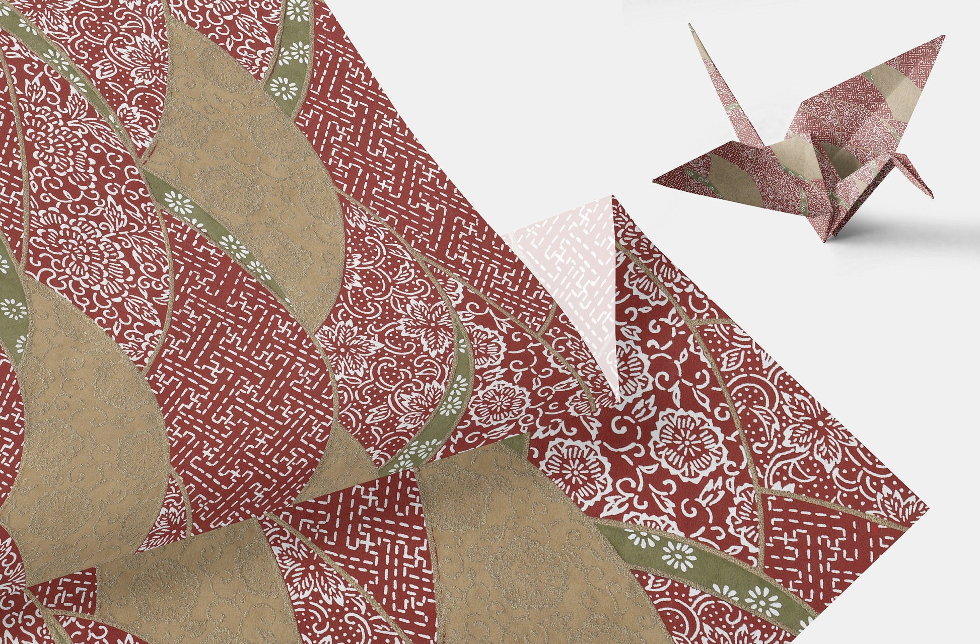 Patterned chiyogami paper with a folded paper crane on a white background