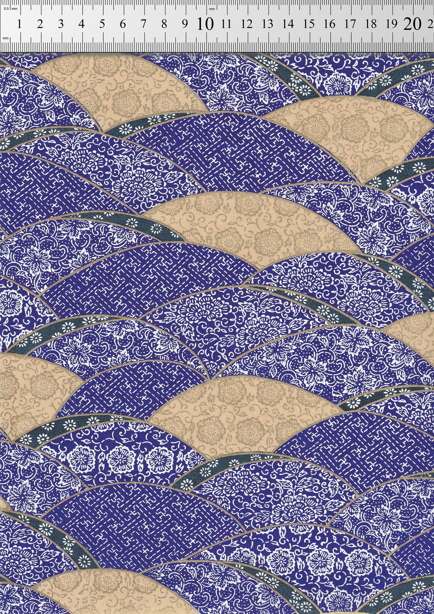 Patterned  chiyogami paper with blue and beige design on a ruler background
