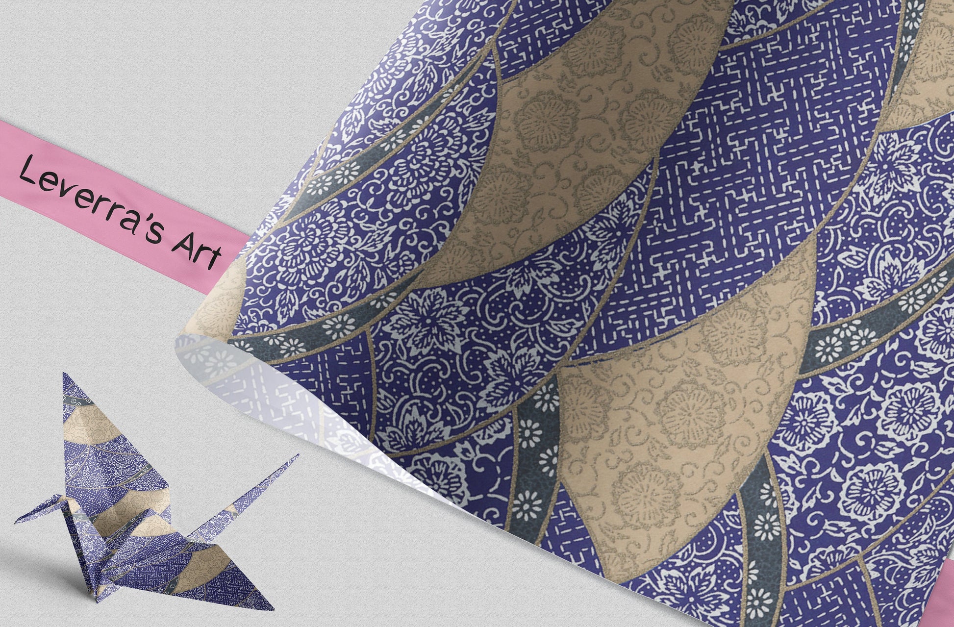 Decorative paper with geometric patterns and a small origami crane on a light gray background.
