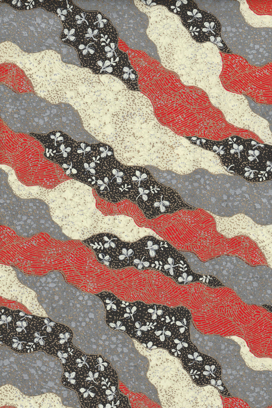 Patterned chiyogami paper with red, black, and beige wavy lines on a gray background