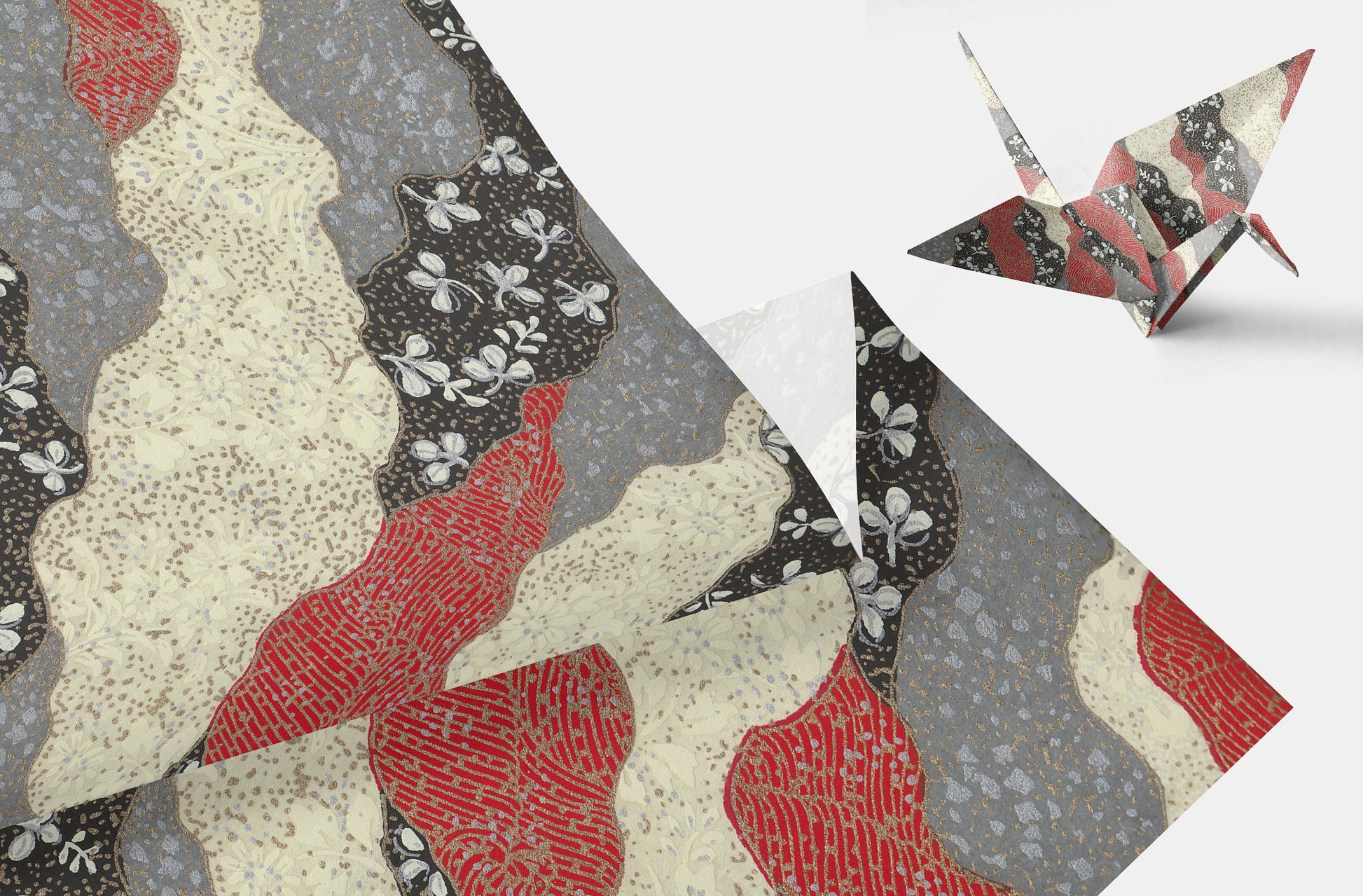Decorative chiyogami paper with geometric patterns and origami-style birds on a white background