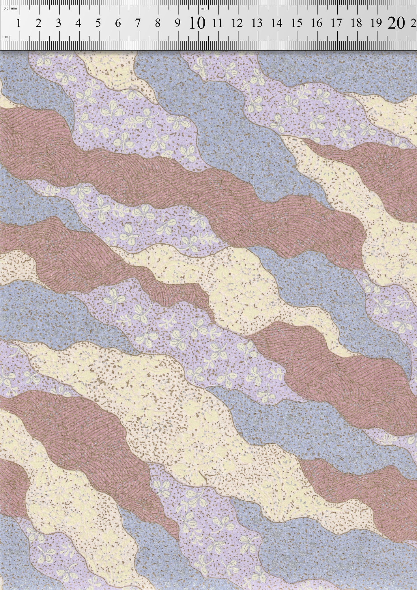 Textured chiyogami paper with wavy pattern in pink, blue, and beige on a white background.