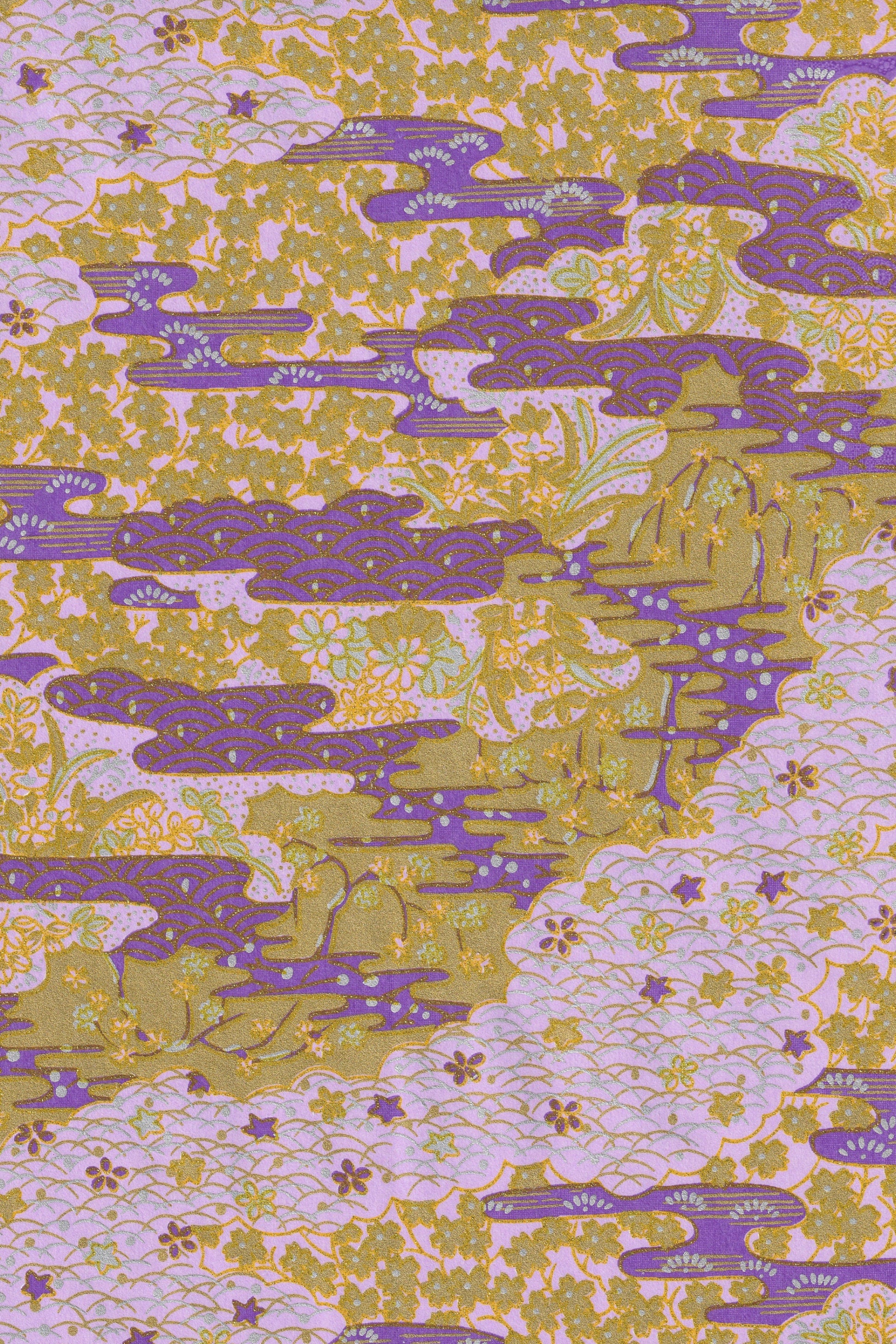 Patterned  chiyogami paper with purple and green design on a light background
