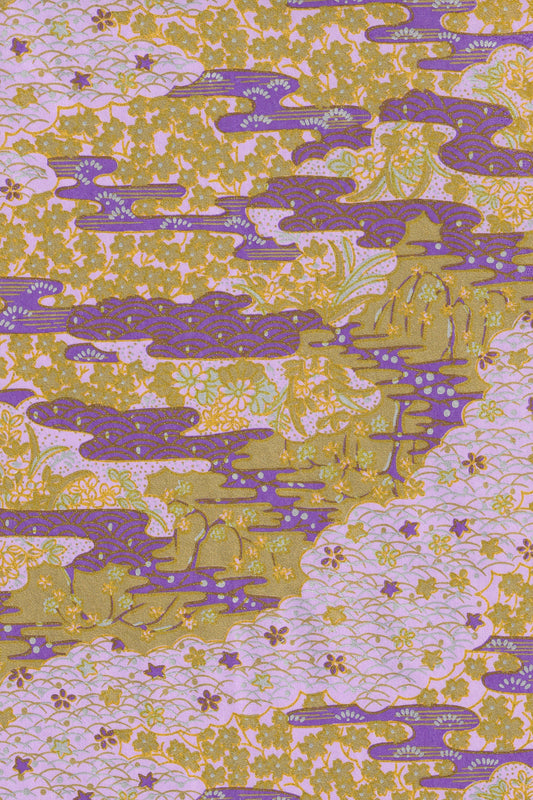 Patterned  chiyogami paper with purple and green design on a light background