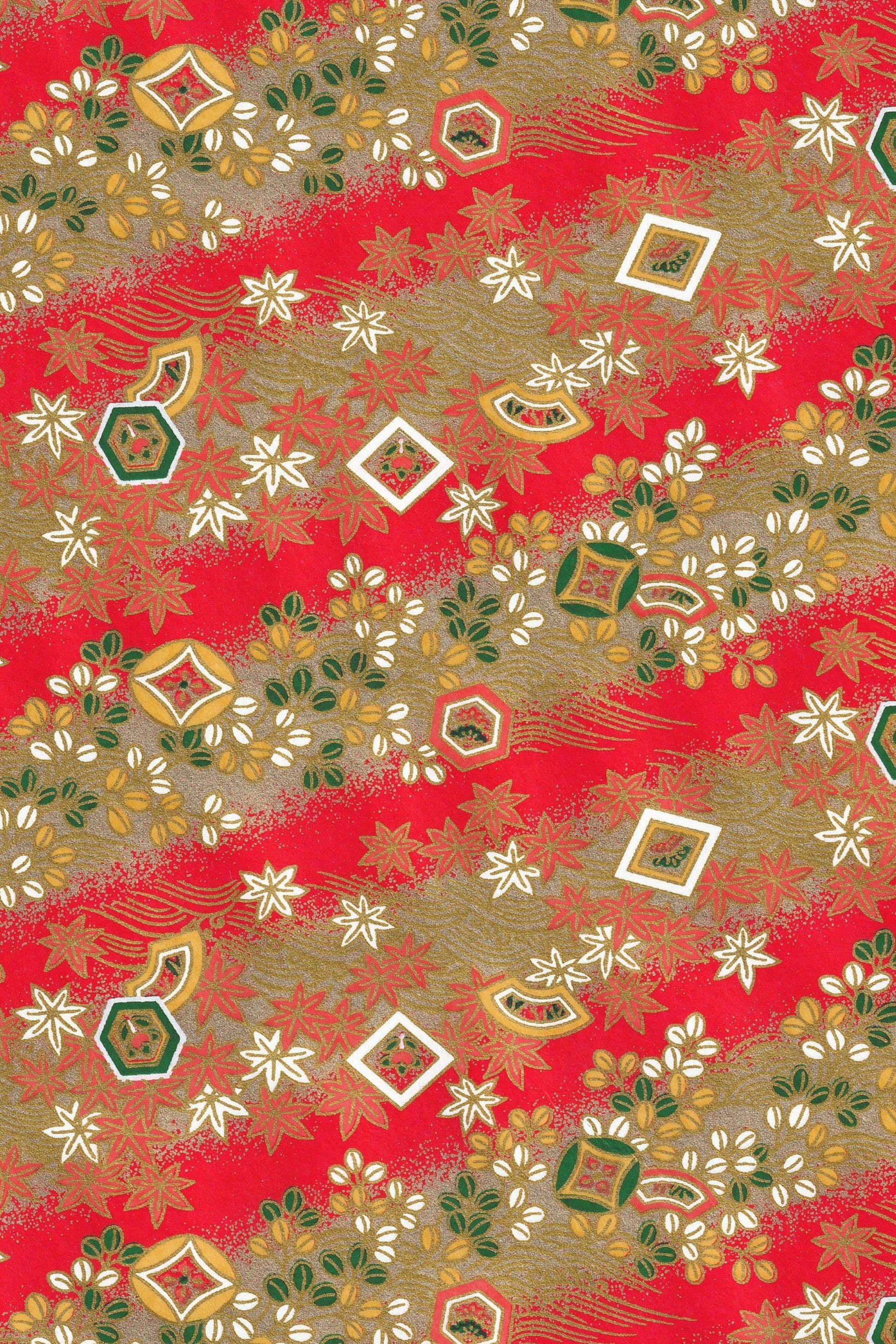 Decorative chiyogami paper with geometric patterns on a red background