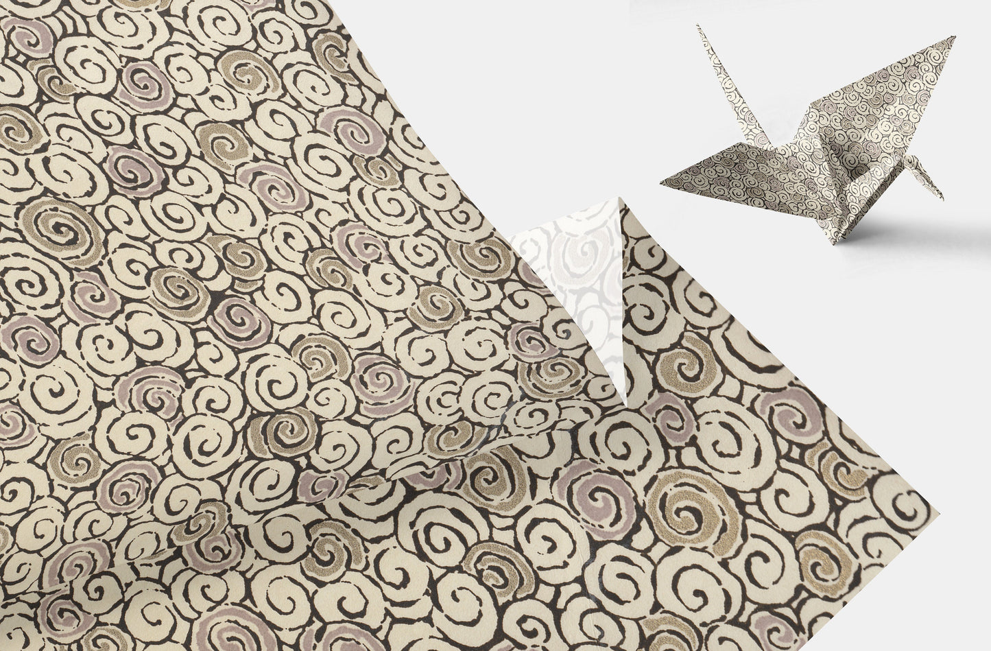 Patterned chiyogami paper with origami cranes on a white background