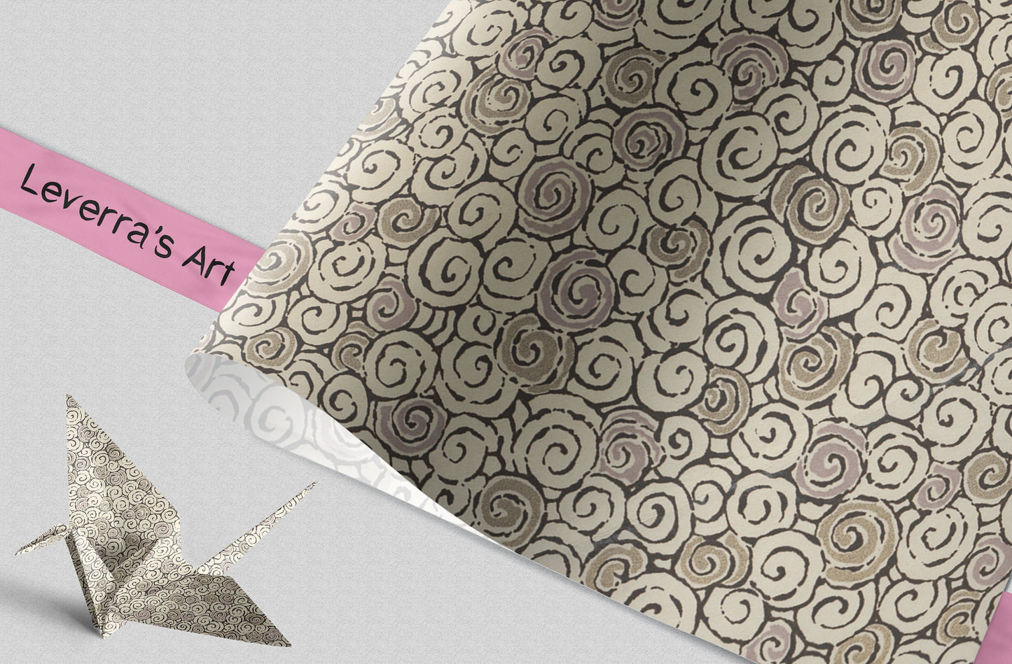 Patterned chiyogami paper with swirl design and a silver origami crane on a light gray background, featuring 'Leverra's Art' branding.
