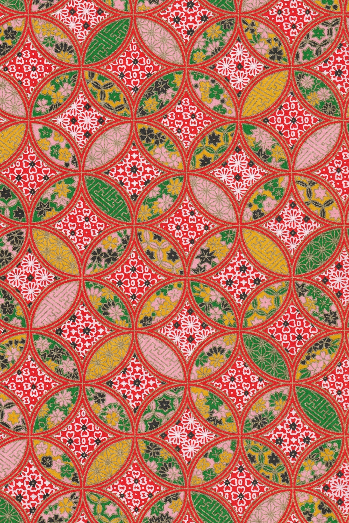 Decorative chiyogami paper with a geometric pattern in red, green, and yellow.