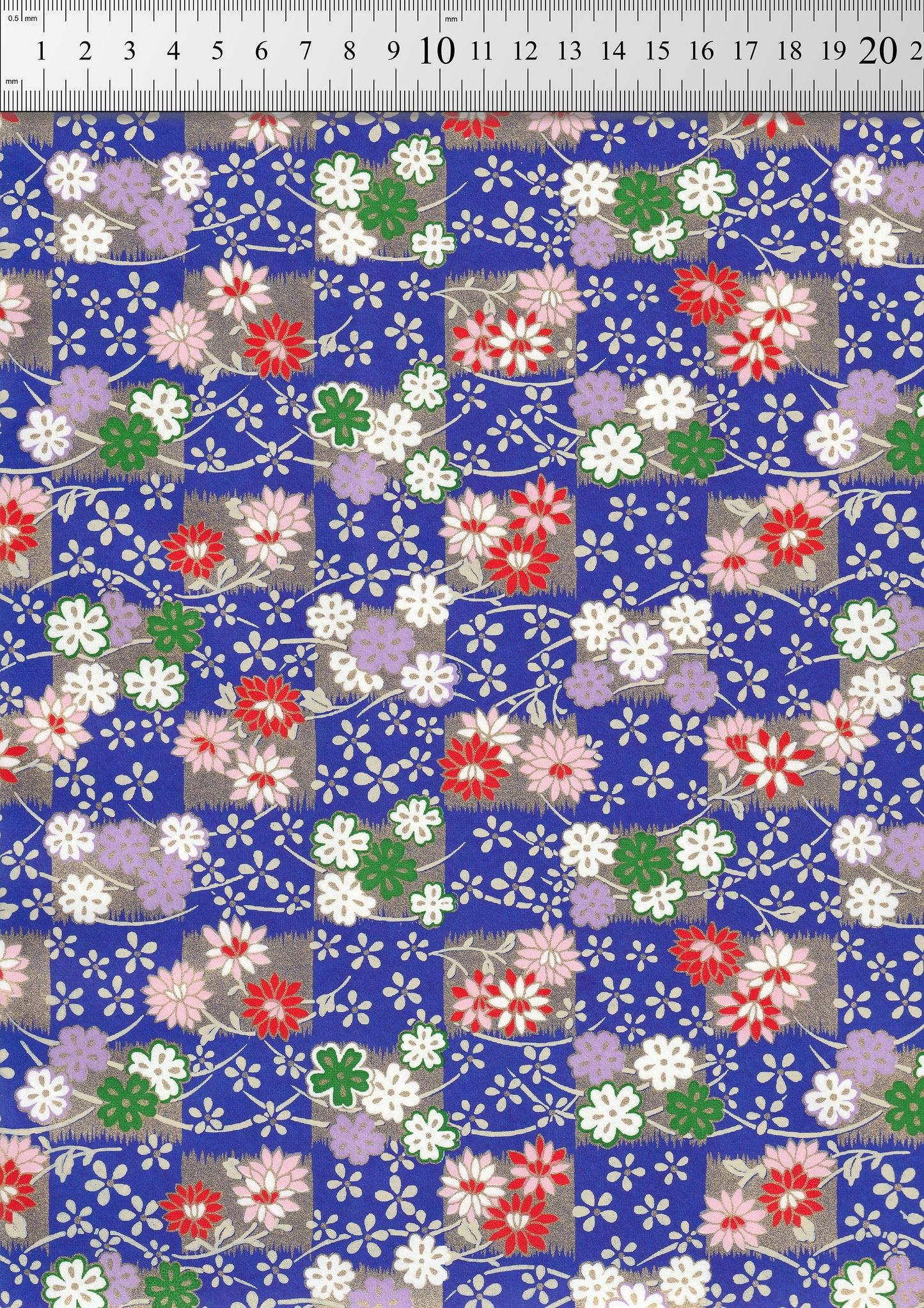 Floral patterned chiyogami paper with a ruler at the top for scale.